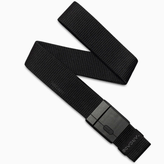 The Arcade Belts Golf Kit is a black nylon webbing belt with a rectangular black buckle, laid flat on a white background. Its lightweight woven flex offers course-ready comfort and a simple, functional design for everyday wear.