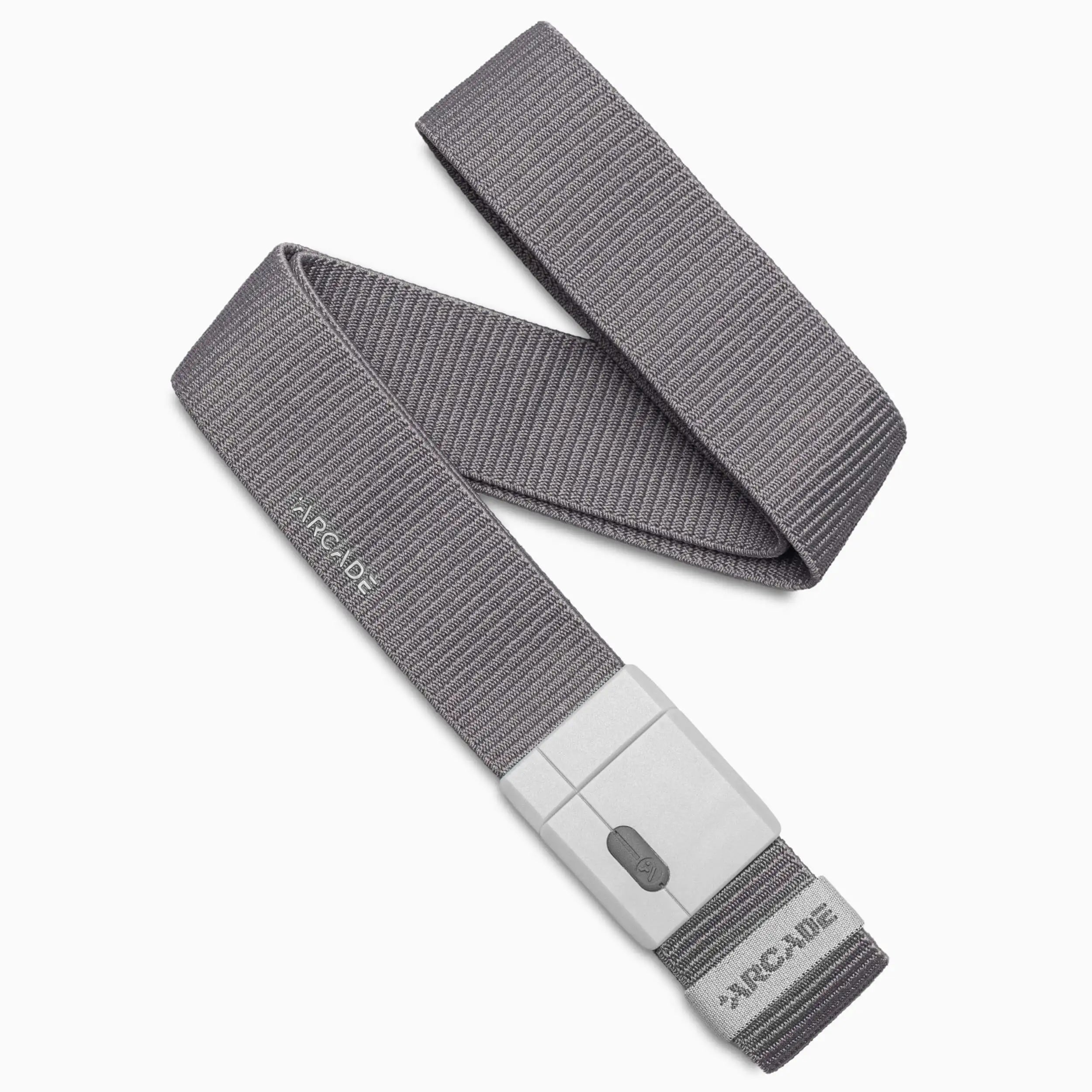 An Aero Mag belt from Arcade Belts, made of gray woven fabric and featuring a rectangular gray plastic buckle, is coiled on a white background. The brand name Arcade Belts is visible on both the belt and the durable buckle, designed for long-lasting wear.