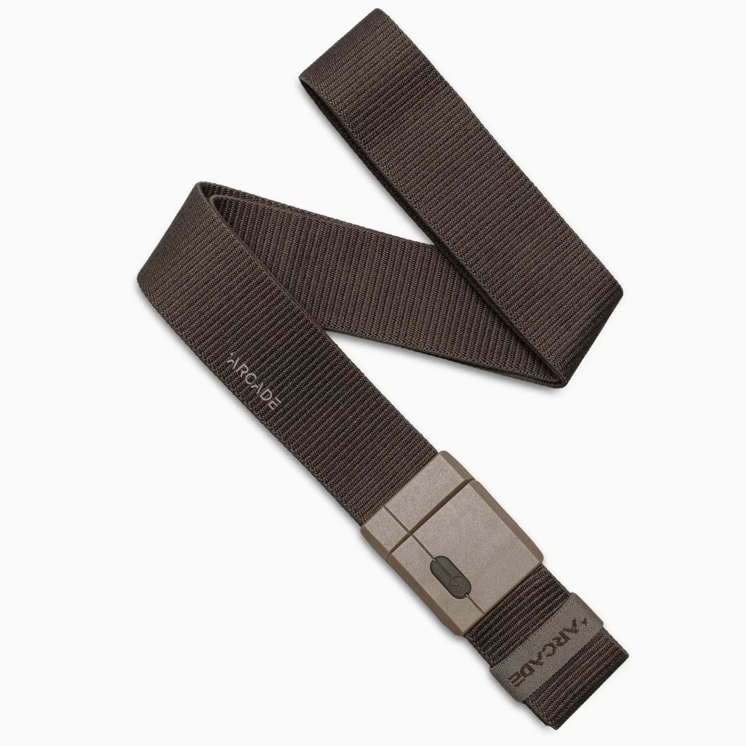 The Arcade Belts Aero Mag is a medium brown textured fabric belt with a sturdy rectangular gray buckle. The belt is partially coiled, displaying the "ARCADE" logo on both the buckle and strap.