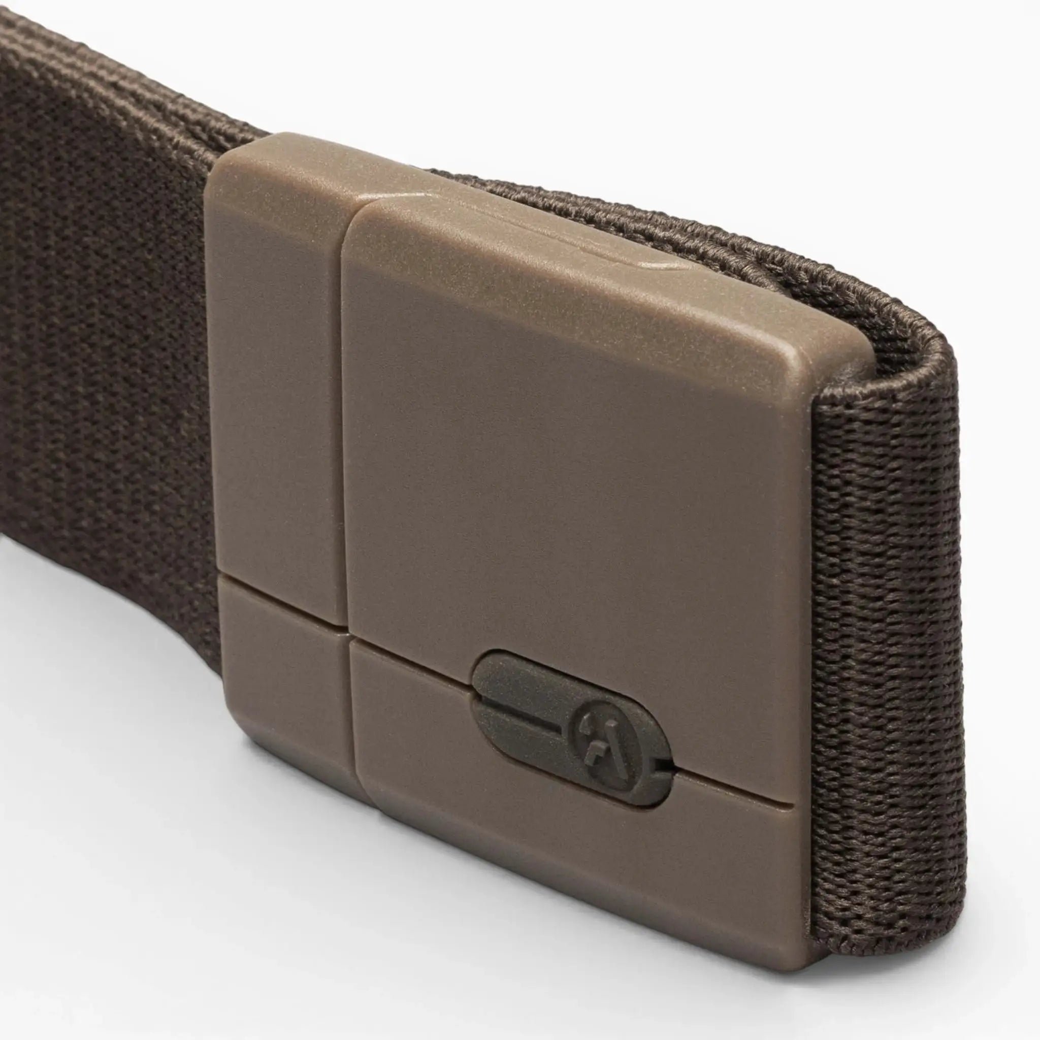 A close-up view of the Aero Mag belt by Arcade Belts showcases its brown fabric construction, a durable rectangular buckle with a small keyhole on the surface, and a secure tension lock mechanism.