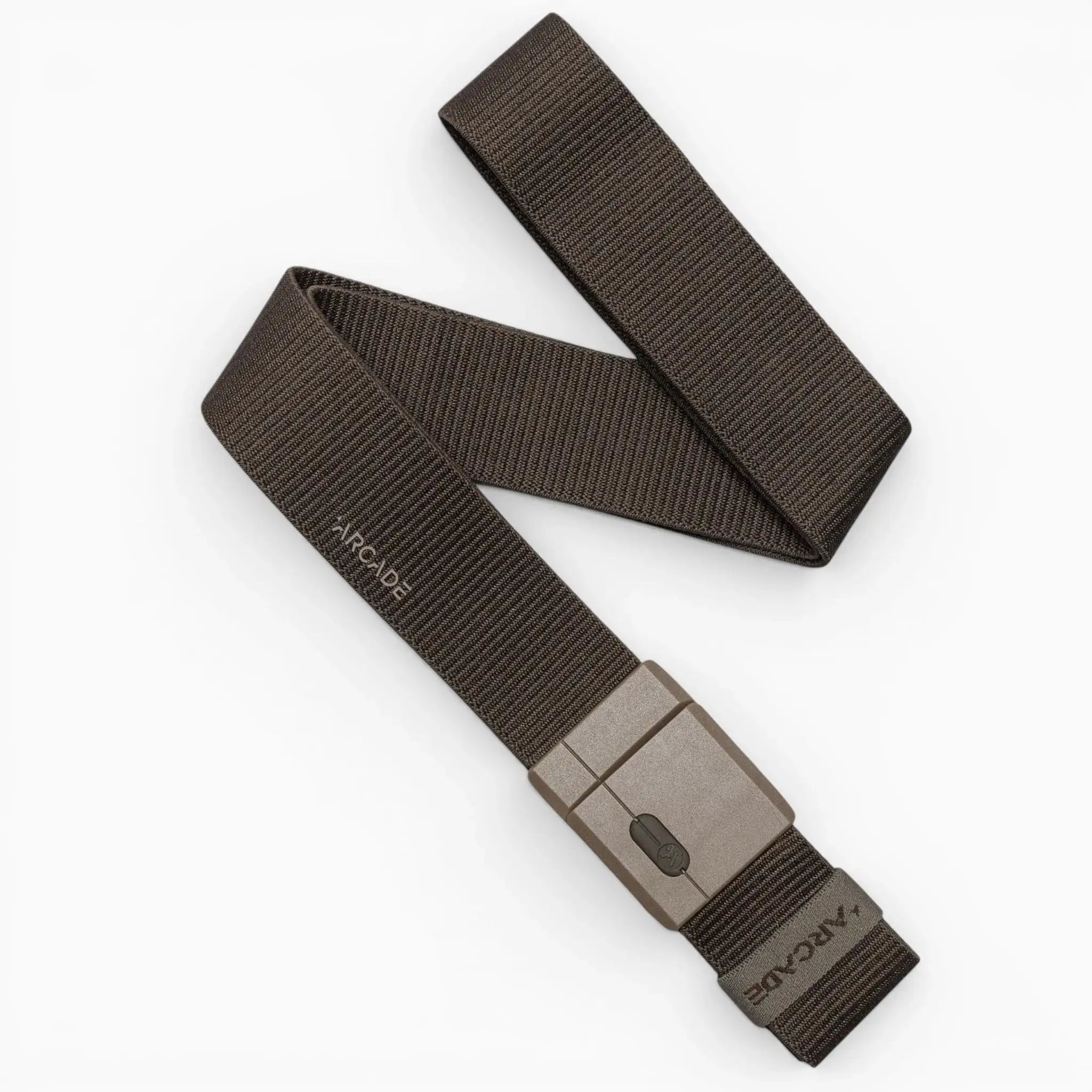 A dark brown, textured Aero Mag belt by Arcade Belts features a durable gray rectangular buckle, with the word "ARCADE" visible near the buckle. The belt is arranged in a loose S-shaped curve on a white background.