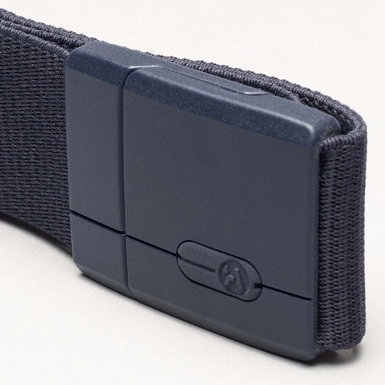 A close-up of the Aero belt by Arcade Belts, featuring dark gray fabric and a matte rectangular plastic buckle, displayed against a light background.