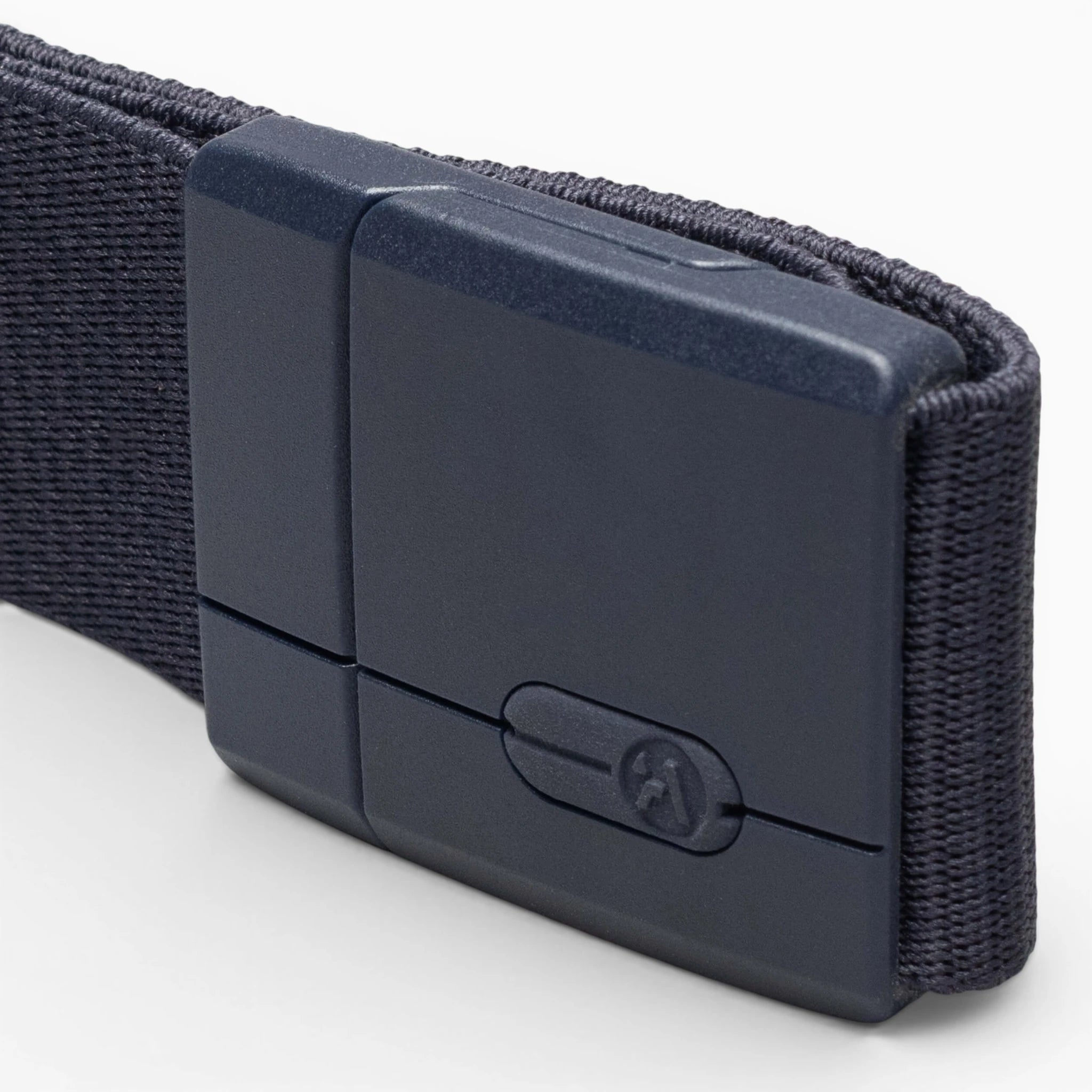 A close-up of the Aero Mag by Arcade Belts, featuring a durable black rectangular buckle attached to a woven black belt, set against a white background.