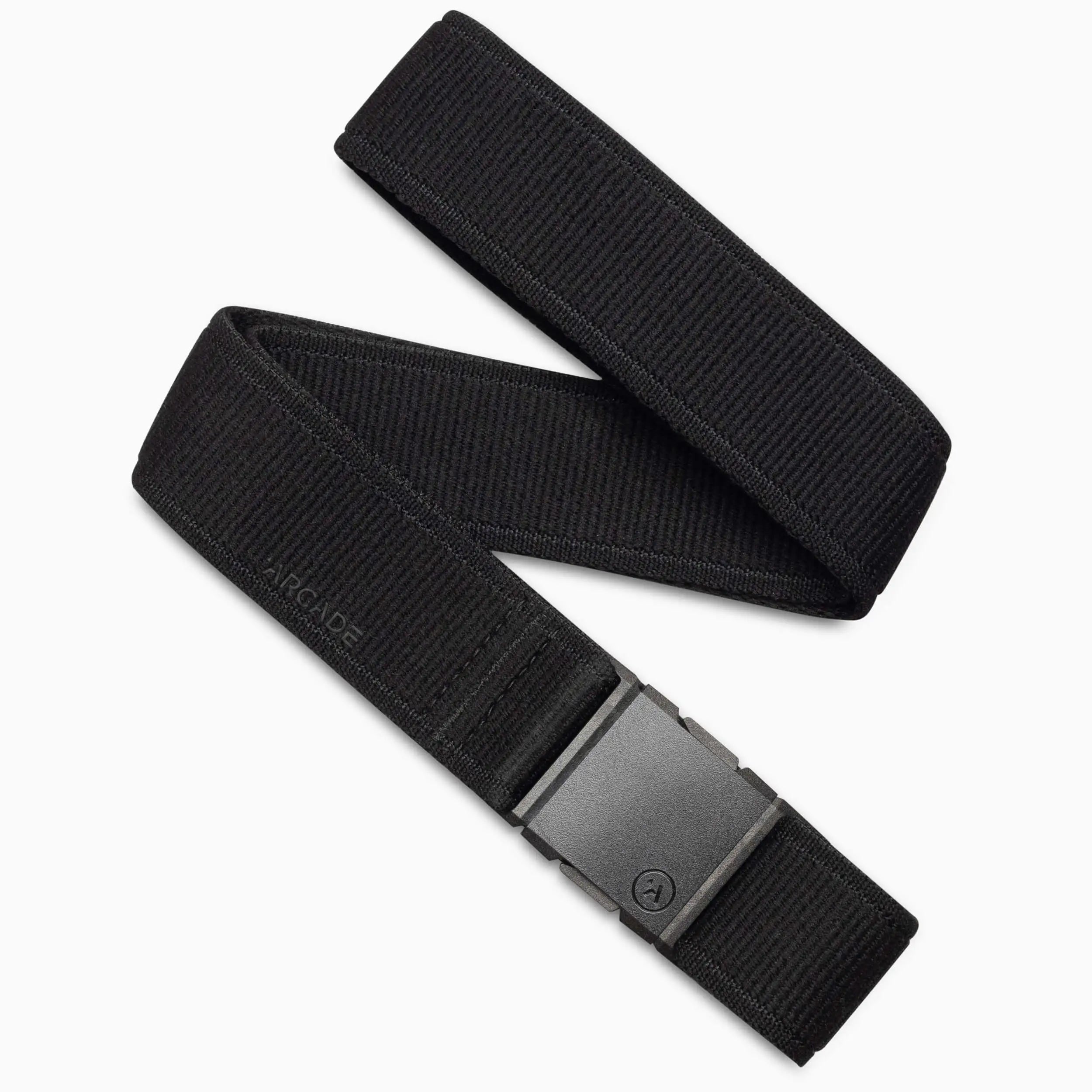 The Atlas belt by Arcade Belts features black stretch webbing for comfort, a rectangular plastic buckle, and a subtle ARCADE emboss near the buckle, emphasizing its simple, minimalist design.