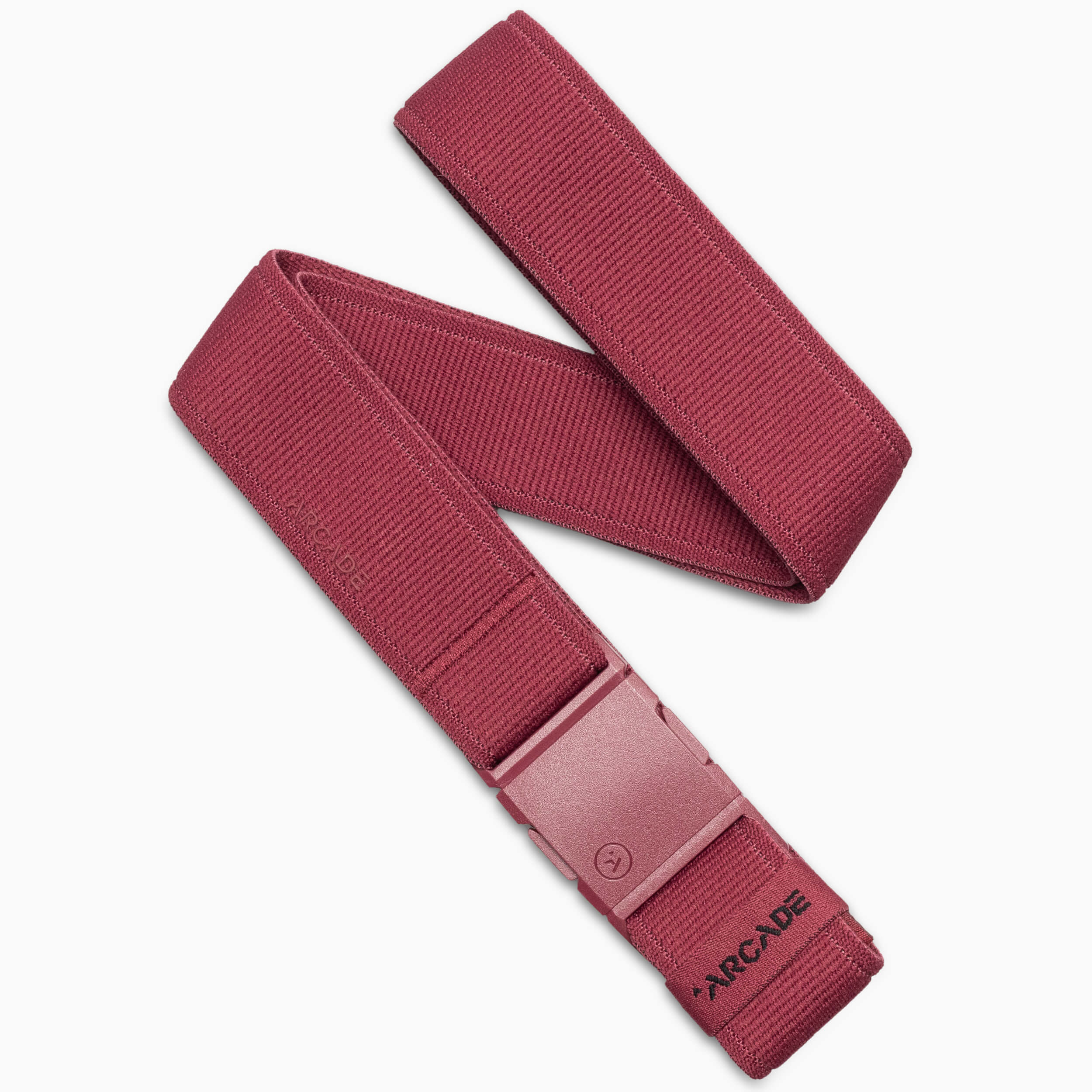 An Ember-colored Atlas adventure belt by Arcade Belts, featuring a rectangular A2 buckle and partially rolled up. The word ARCADE is printed in black near the end of this performance stretch belt.