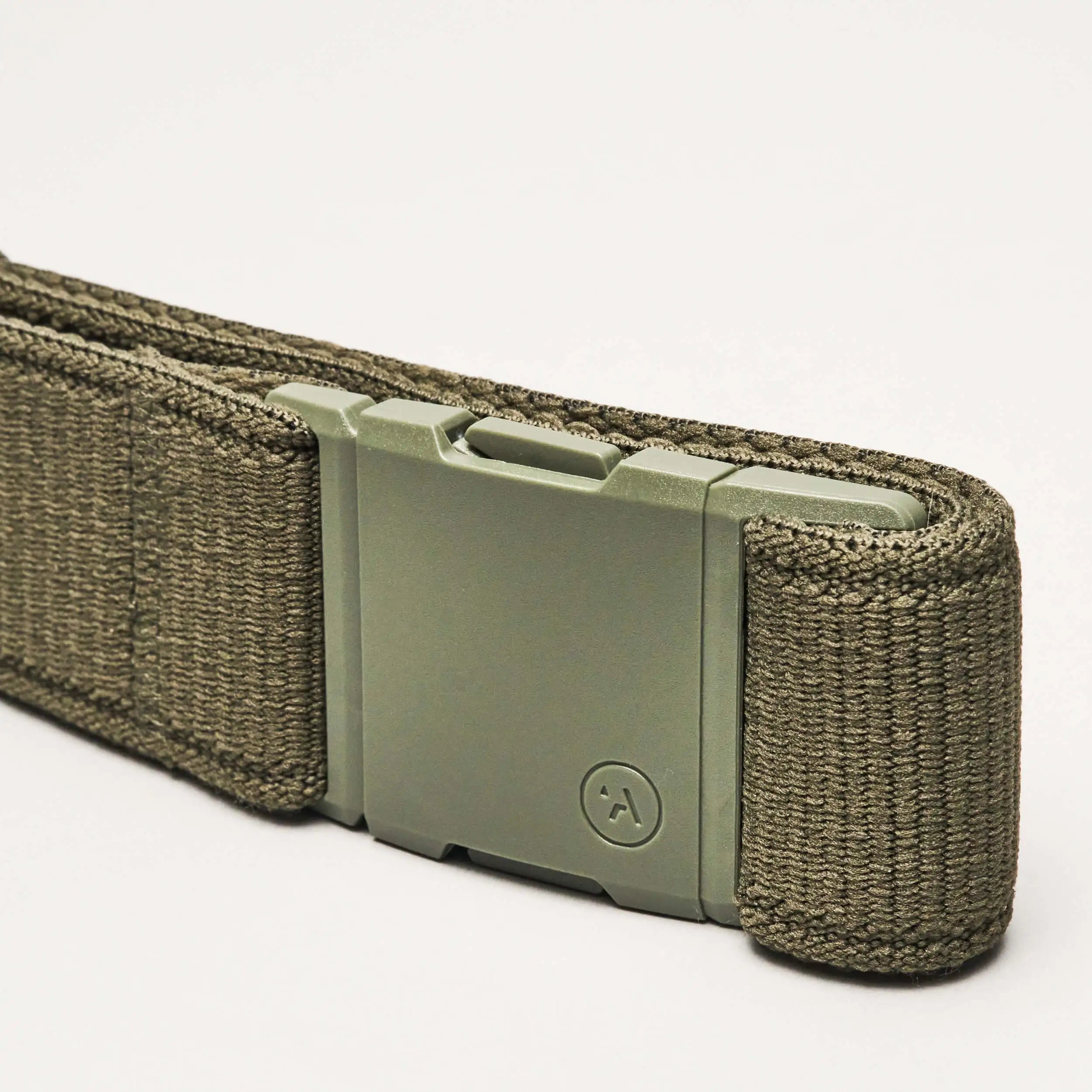 A close-up of the olive green Atlas Low Profile Belt by Arcade Belts, featuring a sturdy rectangular metal buckle and durable woven material, set against a plain white background.