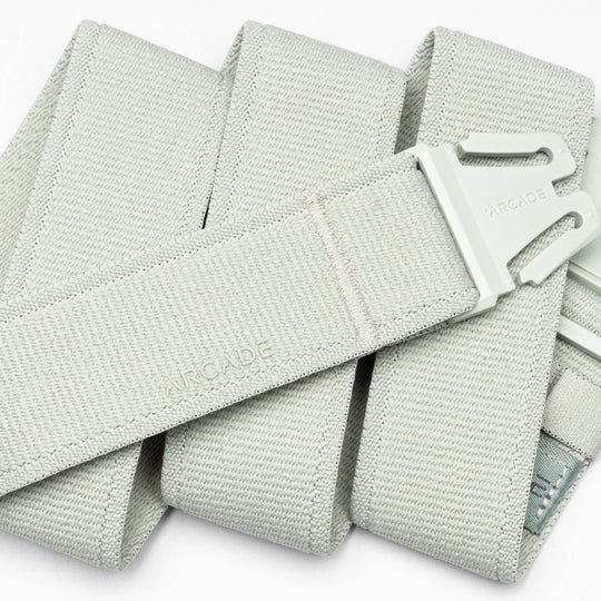 A close-up of the Atlas adventure belt in light gray by Arcade Belts, featuring an A2 buckle and the Arcade logo embossed on both the buckle and the belt.