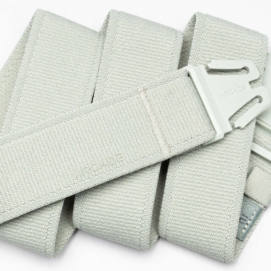 A close-up of the Atlas adventure belt in light gray by Arcade Belts, featuring an A2 buckle and the Arcade logo embossed on both the buckle and the belt.