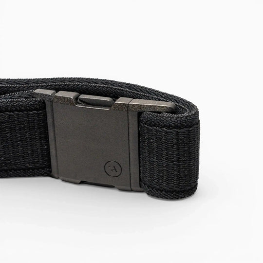 A close-up of the Arcade Belts Atlas low profile belt, featuring stretch webbing and a rectangular black plastic buckle, displayed against a plain white background.