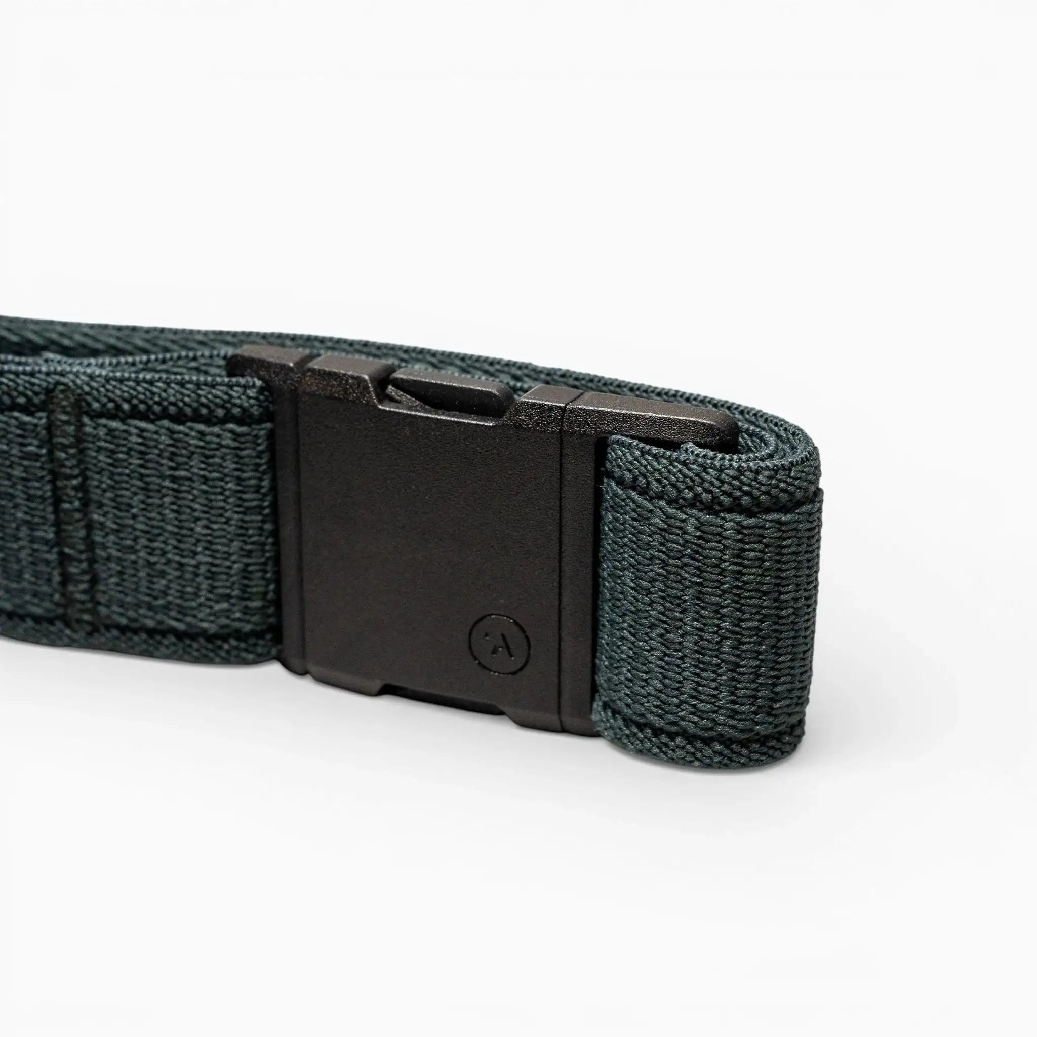 A close-up of an Atlas belt by Arcade Belts features a dark green woven strap and a black plastic buckle, displayed on a light gray background.