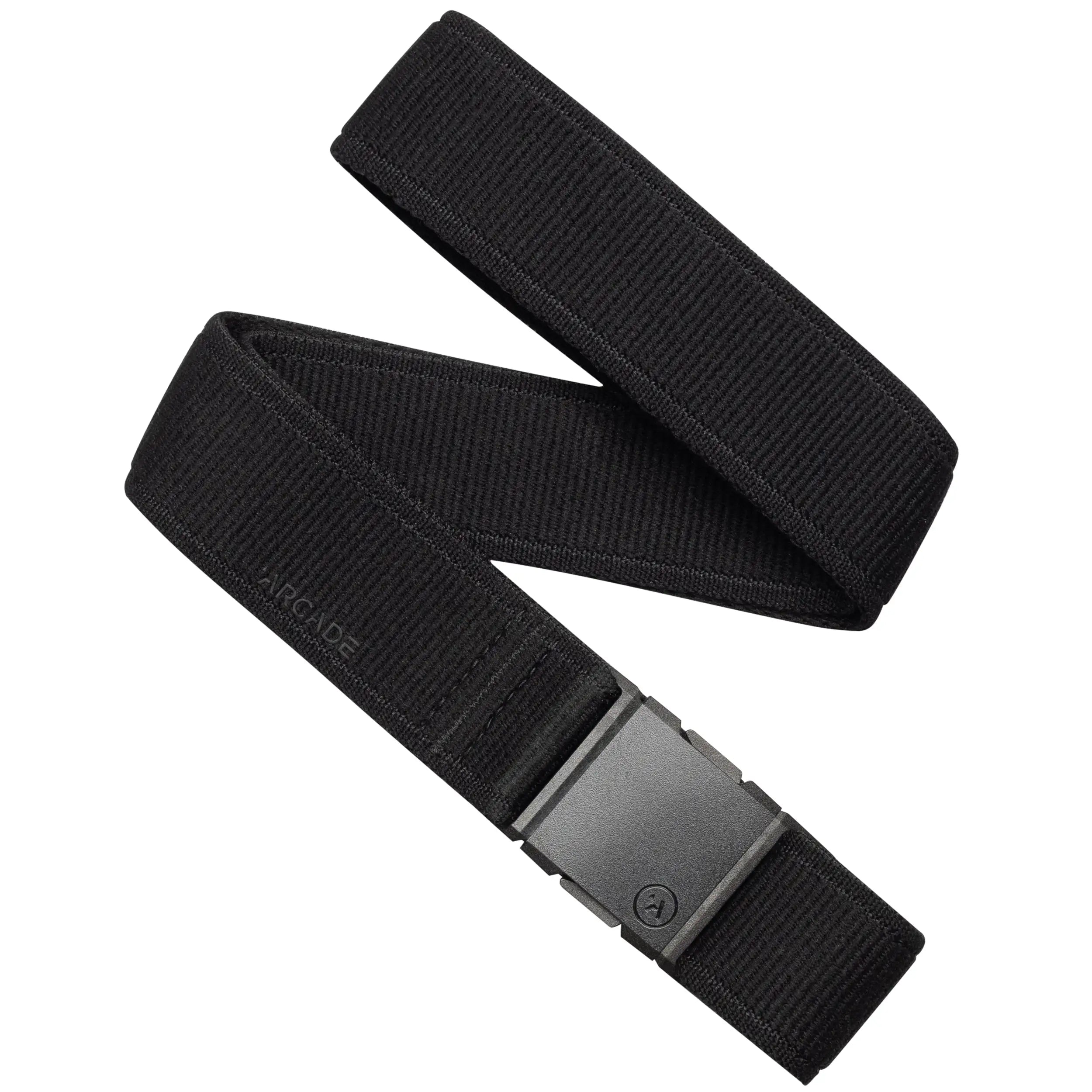 The Atlas Long Kit by Arcade Belts is a black elastic stretch belt with a rectangular black buckle, partially coiled and featuring a subtle “ARCADE” logo near the buckle—ideal for travel and daily comfort.