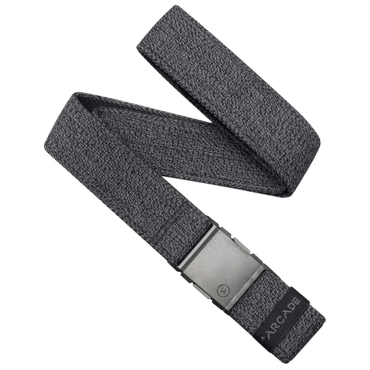 The Atlas Long Kit by Arcade Belts is a gray stretch webbing belt with a rectangular metal buckle and a black ARCADE label on one end, displayed in a zigzag shape on a white background.