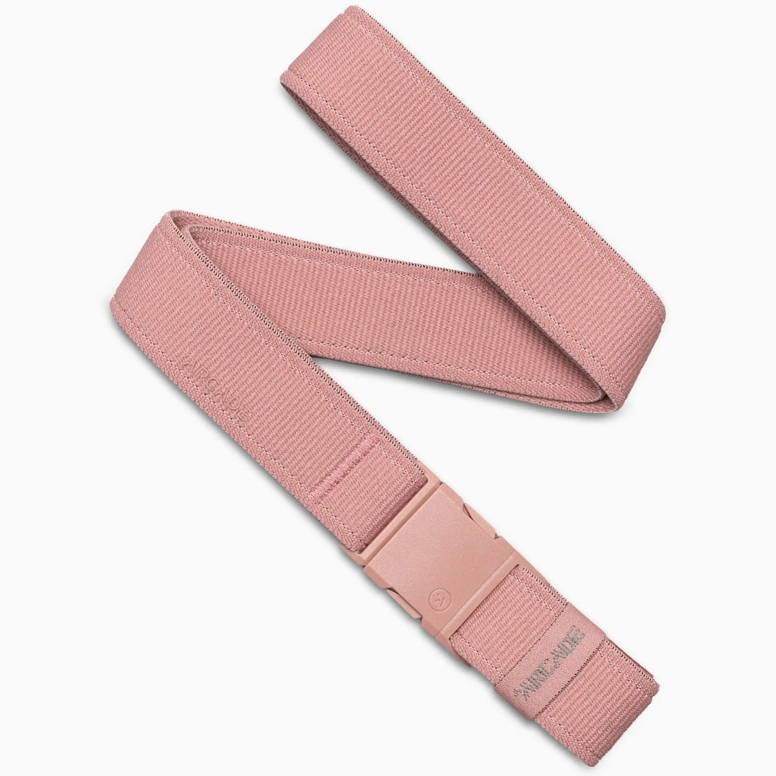 The Atlas by Arcade Belts is a pink adventure belt with a matching pink plastic A2 buckle, shown flat with one end looped over. The clipped buckle and textured, woven design complete its stylish look.