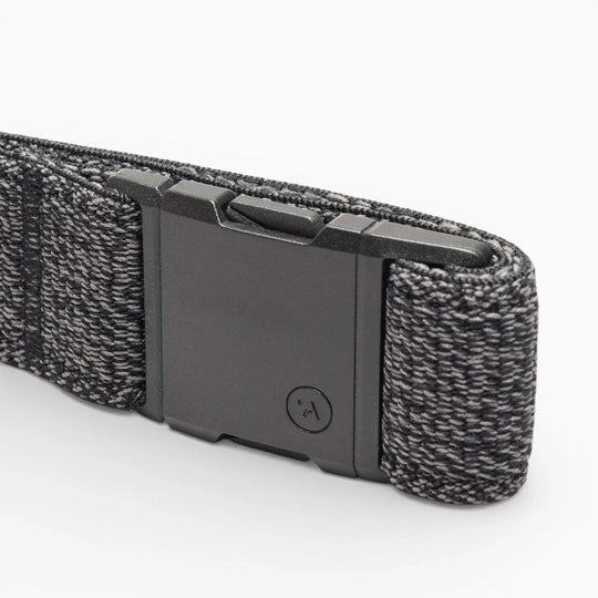 A close-up of the black and gray Atlas Low Profile Belt by Arcade Belts with a rectangular plastic buckle, displayed on a white background—ideal for travel belt enthusiasts.