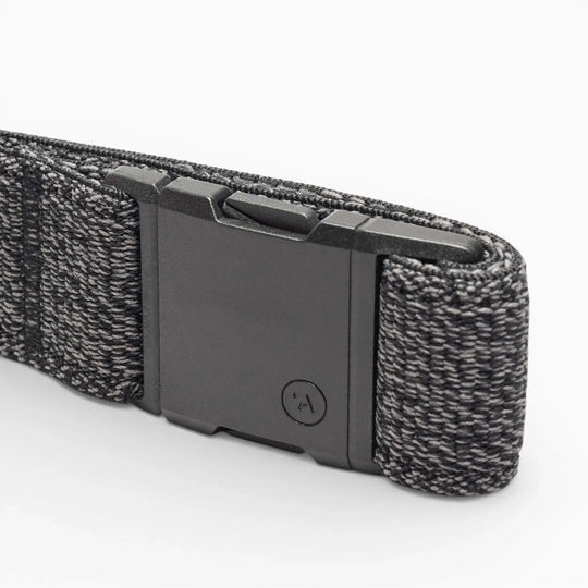 A close-up of the black and gray Atlas Low Profile Belt by Arcade Belts with a rectangular plastic buckle, displayed on a white background—ideal for travel belt enthusiasts.