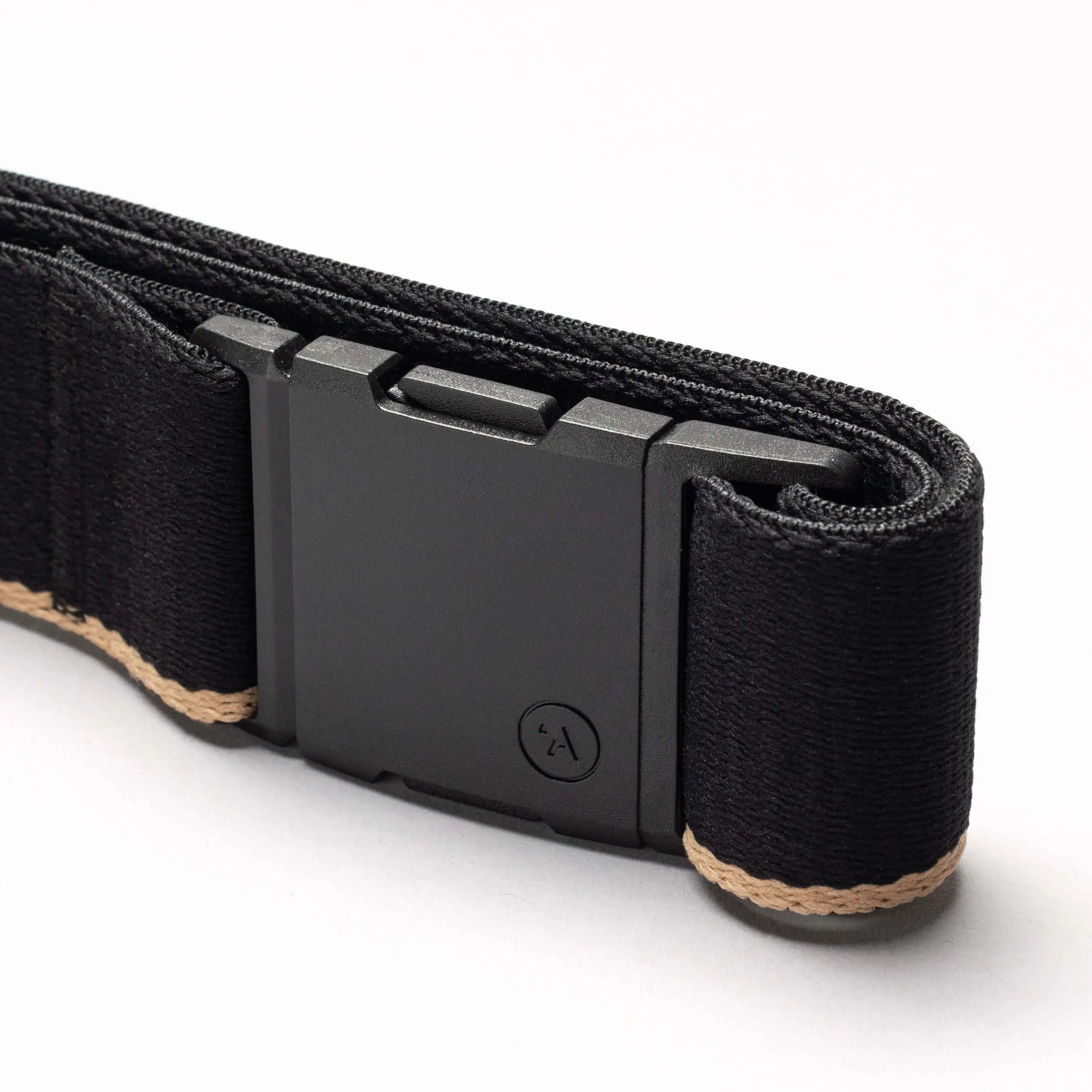 A close-up of the Arcade Belts Blackwood belt shows its rectangular A2 buckle and beige edge stitching on the black strap, set against a plain white background.