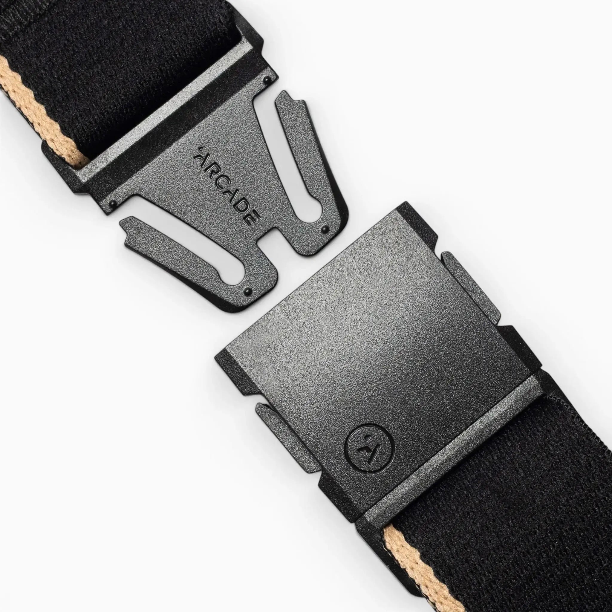 Close-up of the Arcade Belts Blackwood belt with an A2 buckle. This black belt features a beige stripe and a sleek, modern buckle design, representing the signature Arcade classic style.