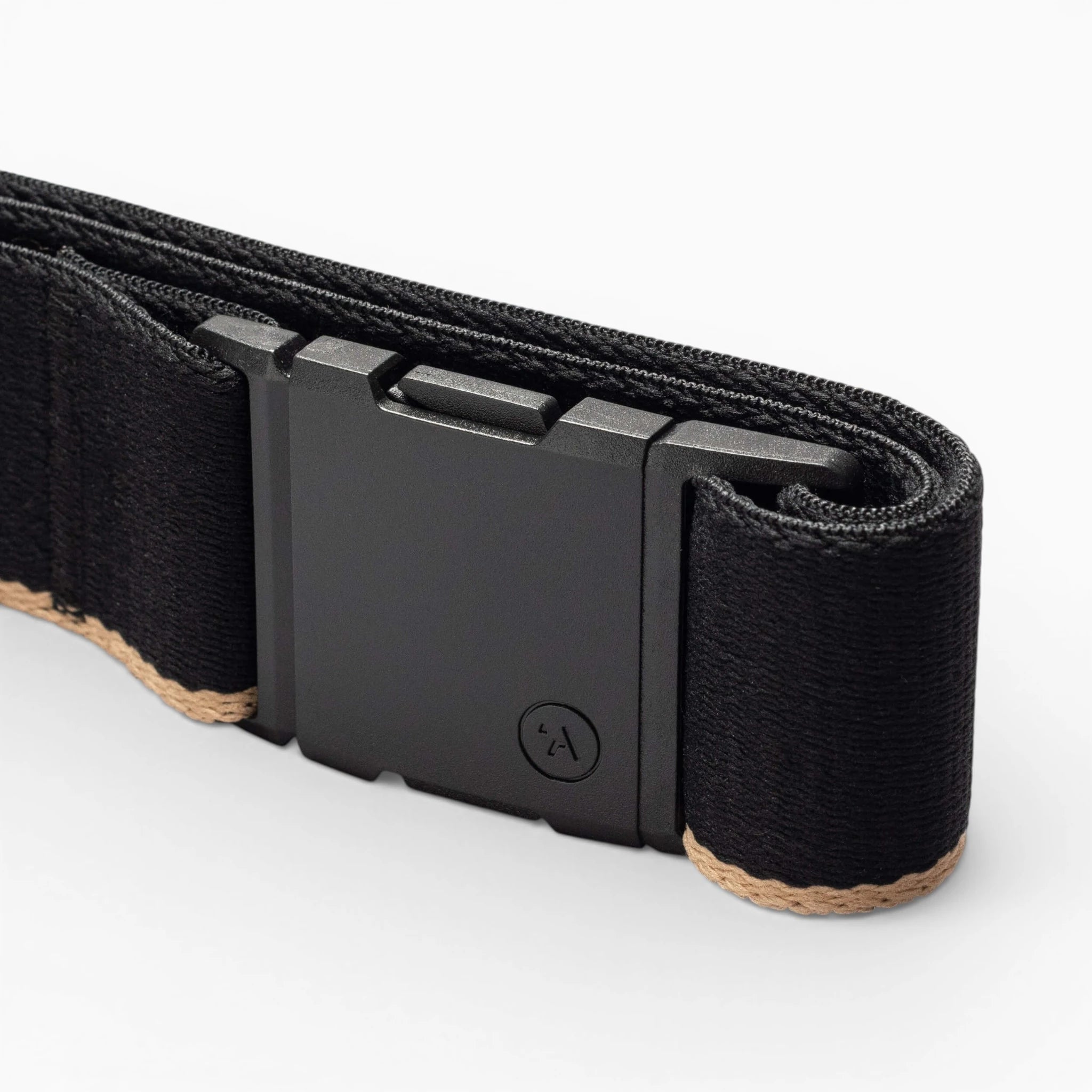 A close-up of the Arcade Belts Blackwood belt shows its rectangular A2 buckle and beige edge stitching on the black strap, set against a plain white background.
