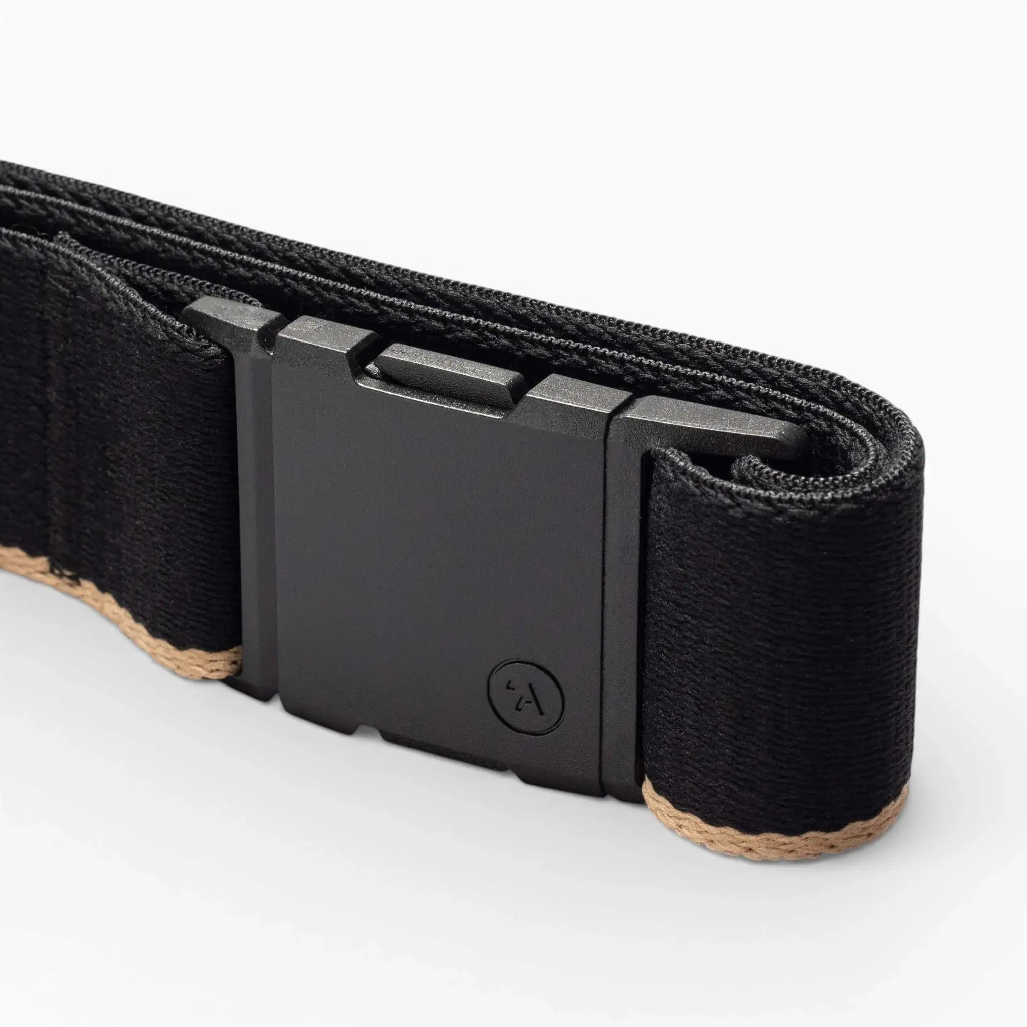 A close-up of the Arcade Belts Blackwood belt shows its rectangular A2 buckle and beige edge stitching on the black strap, set against a plain white background.