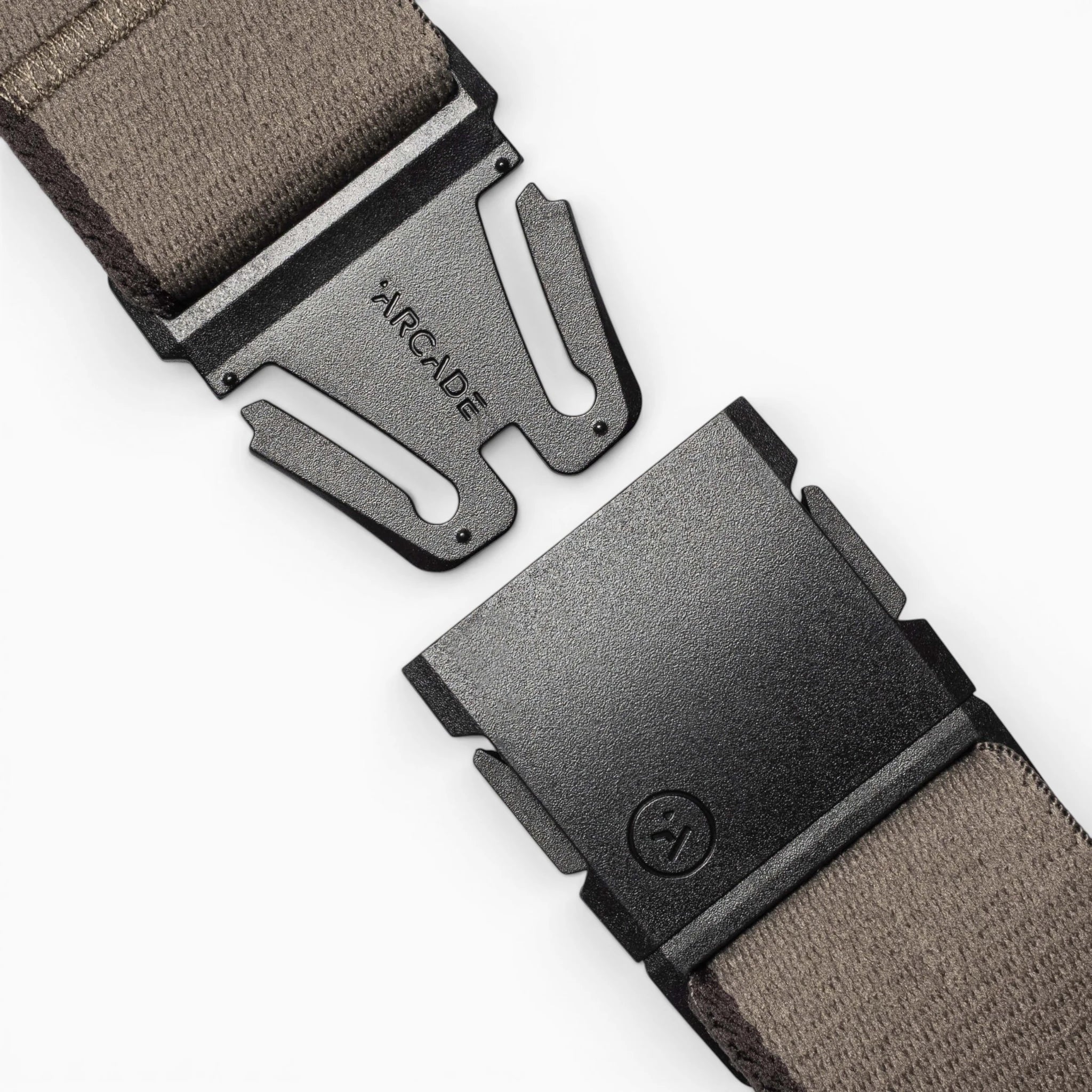 Close-up of the Arcade Belts Blackwood belt, featuring a gray fabric strap and a black metal A2 buckle engraved with "ARCADE," shown open on a light background.