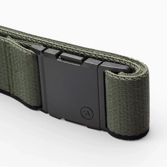 A close-up of the Arcade Belts Blackwood belt in green, featuring a sleek matte black A2 buckle, set against a white background.