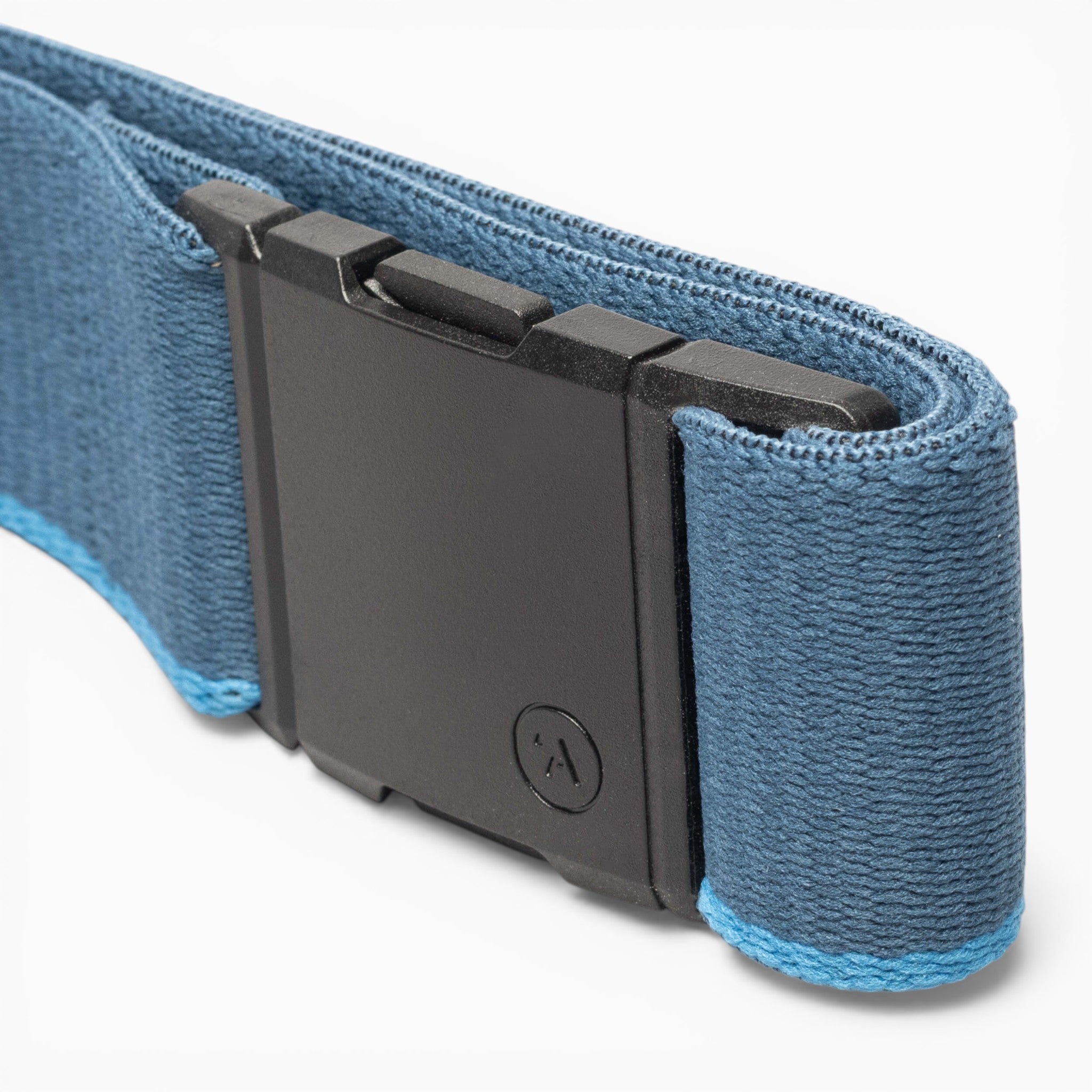 Close-up of a blue fabric Arcade Belts Blackwood belt featuring a rectangular black plastic buckle. The light blue stitching runs along the edges, while the buckle displays a small embossed logo in the signature Blackwood design.