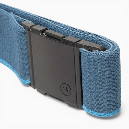 Close-up of a blue fabric Arcade Belts Blackwood belt featuring a rectangular black plastic buckle. The light blue stitching runs along the edges, while the buckle displays a small embossed logo in the signature Blackwood design.