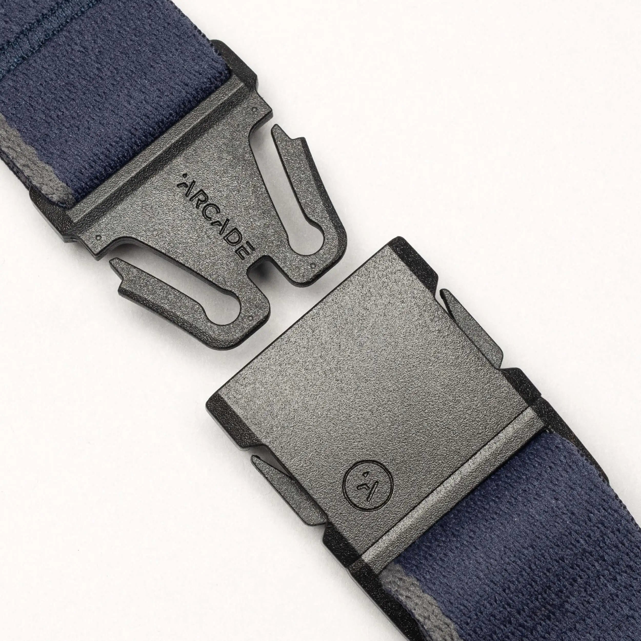 A close-up of the Arcade Belts Blackwood belt featuring a blue strap and a black A2 buckle. The partially open buckle reveals the Arcade Belts logo, all set against a plain white background.