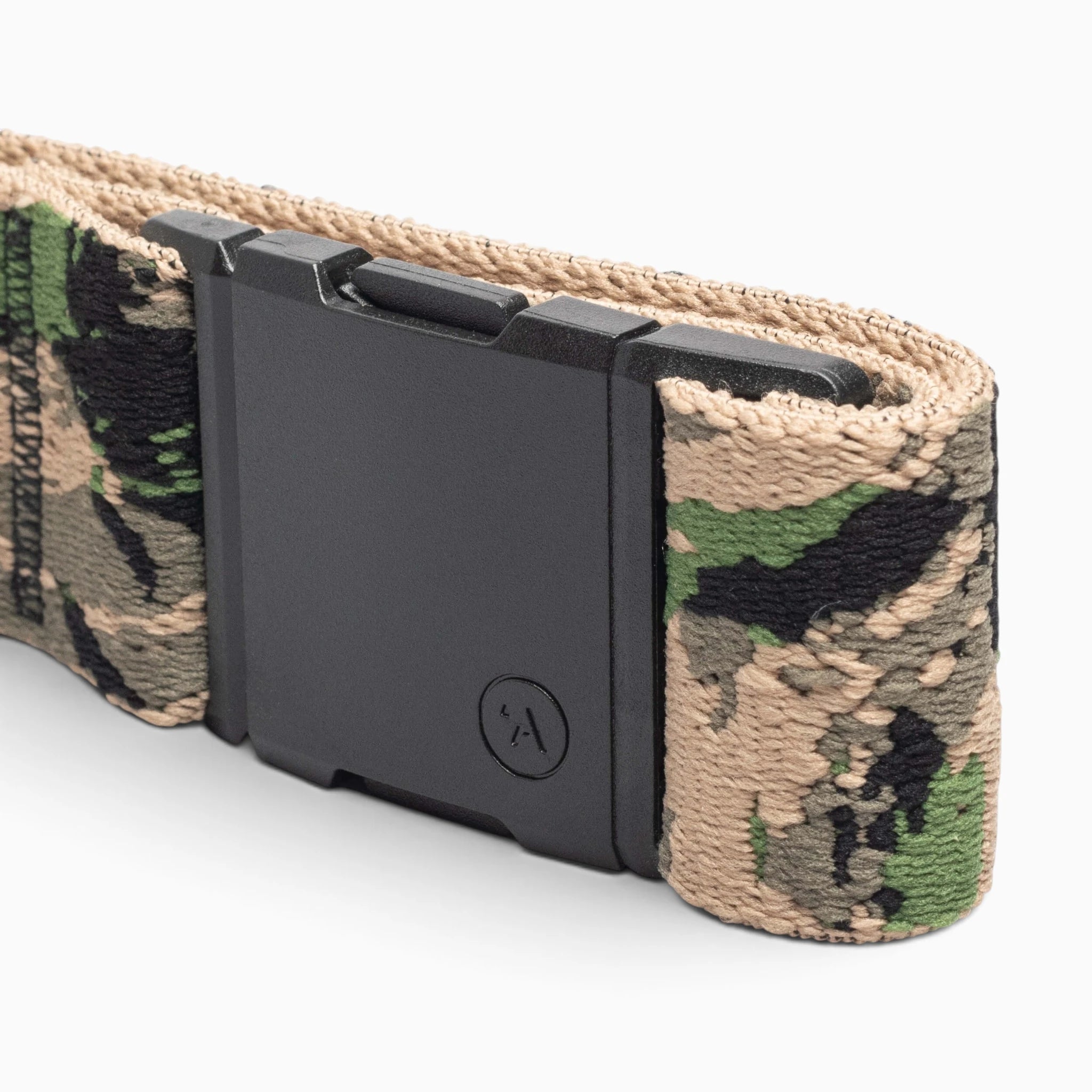Close-up of a camouflage fabric belt with a rectangular black buckle. Part of the Island Collection by Arcade Belts, this Hawaiian-inspired accessory features a camouflage pattern in shades of green, tan, and black, capturing the adventurous Aloha spirit.