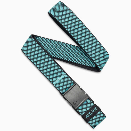 The Arcade Belts Carry is a teal and black grid-patterned woven belt with performance stretch webbing, an A2 buckle, and "ARCADE" printed in teal on the strap.