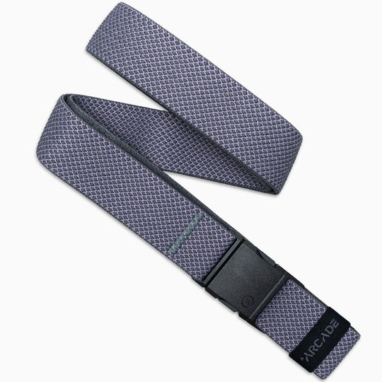 The Carry belt by Arcade Belts features a unique grey weave with a subtle diamond pattern, a black A2 buckle, and ARCADE printed on the end. Its displayed in a loose, overlapping style on a white background.