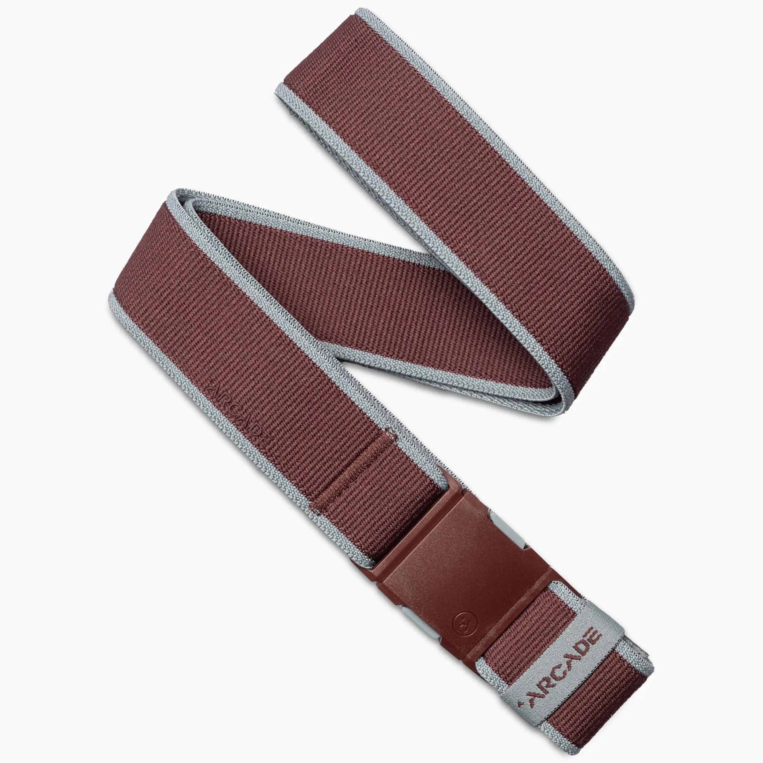 The Arcade Belts Carto is a maroon and gray belt with a plastic buckle, low-profile design, and features the brand name on a small label near the end.
