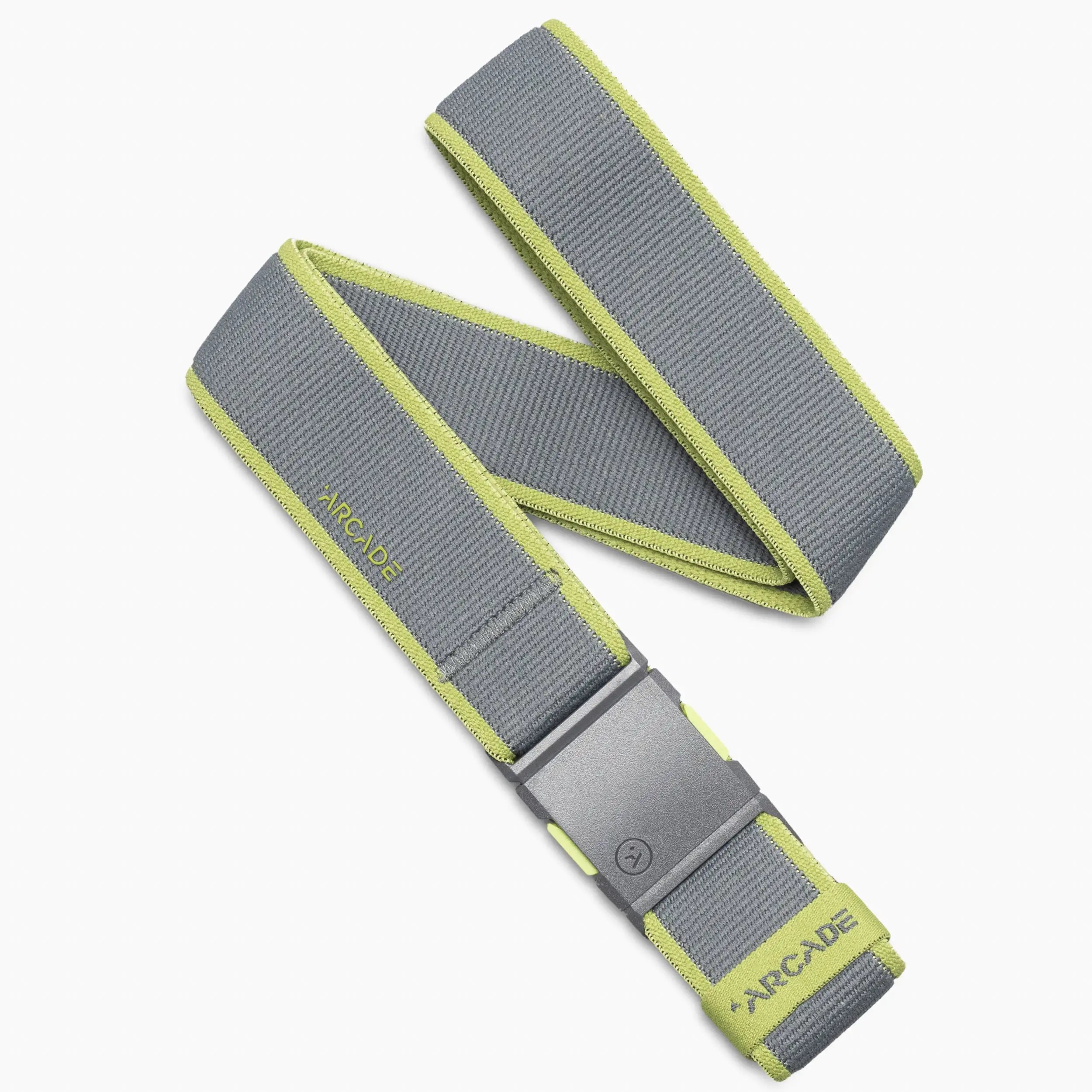 A Shadow Clover fabric adventure belt with lime green edges and a black plastic buckle from Arcade Belts. The brand name is printed in yellow near the buckle, emphasizing its reputation as a high-performance stretch belt perfect for any Carto journey.