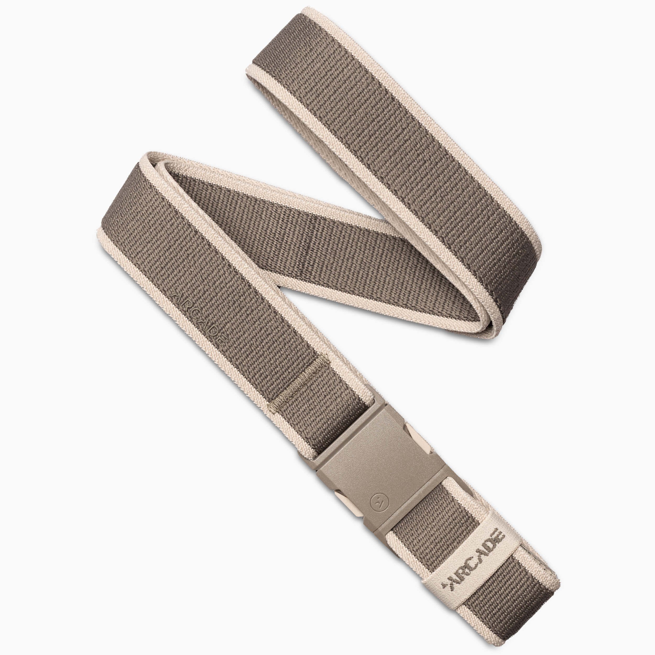The Carto belt by Arcade Belts, shown coiled on a white background in gray and beige, features performance stretch fabric and a plastic buckle—perfect for adventure or daily comfort.
