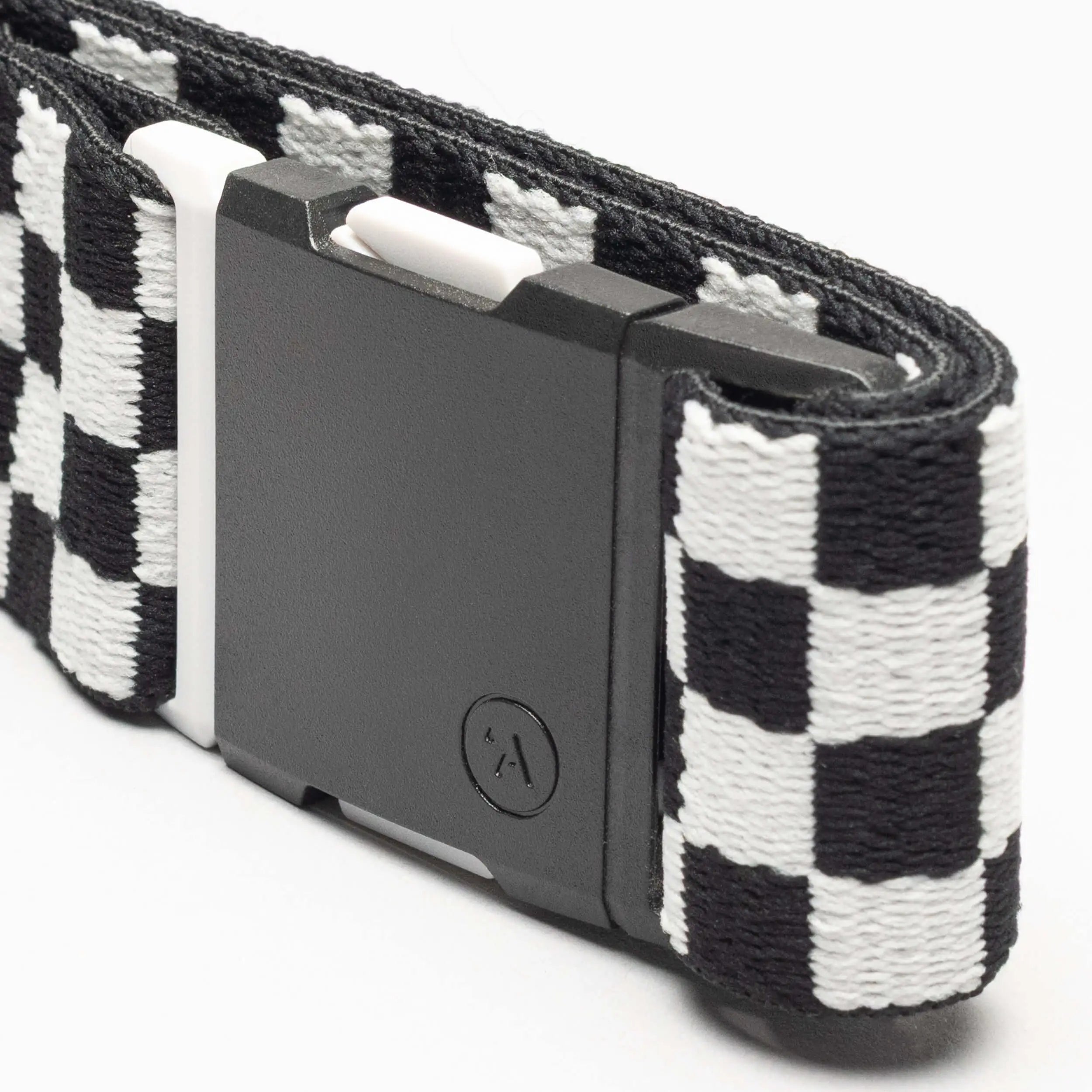 A close-up of the Arcade Belts Check, a black and white checkered fabric belt with a rectangular black plastic buckle, designed for comfort and style, shown against a white background.
