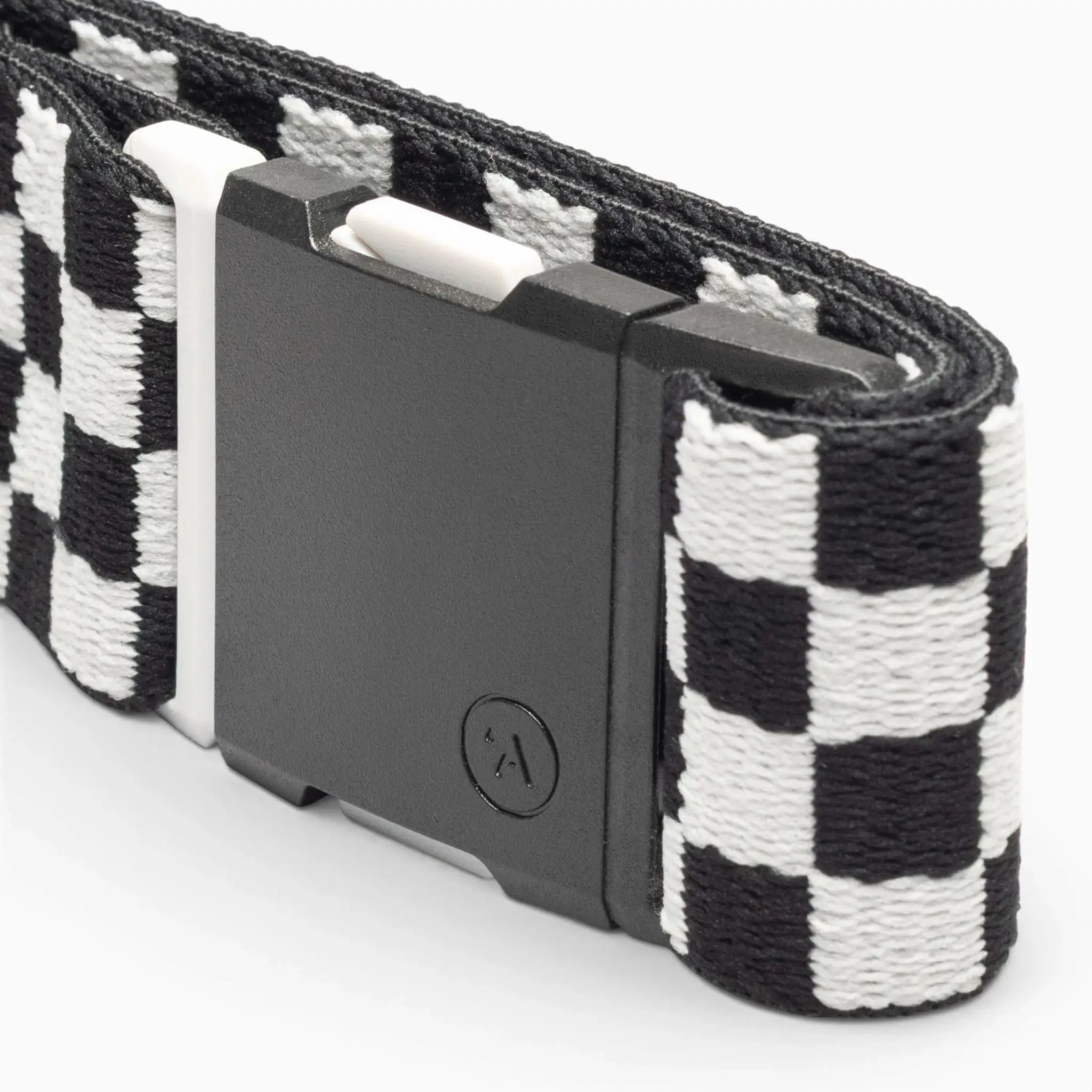 A close-up of the Arcade Belts Check, a black and white checkered fabric belt with a rectangular black plastic buckle, designed for comfort and style, shown against a white background.