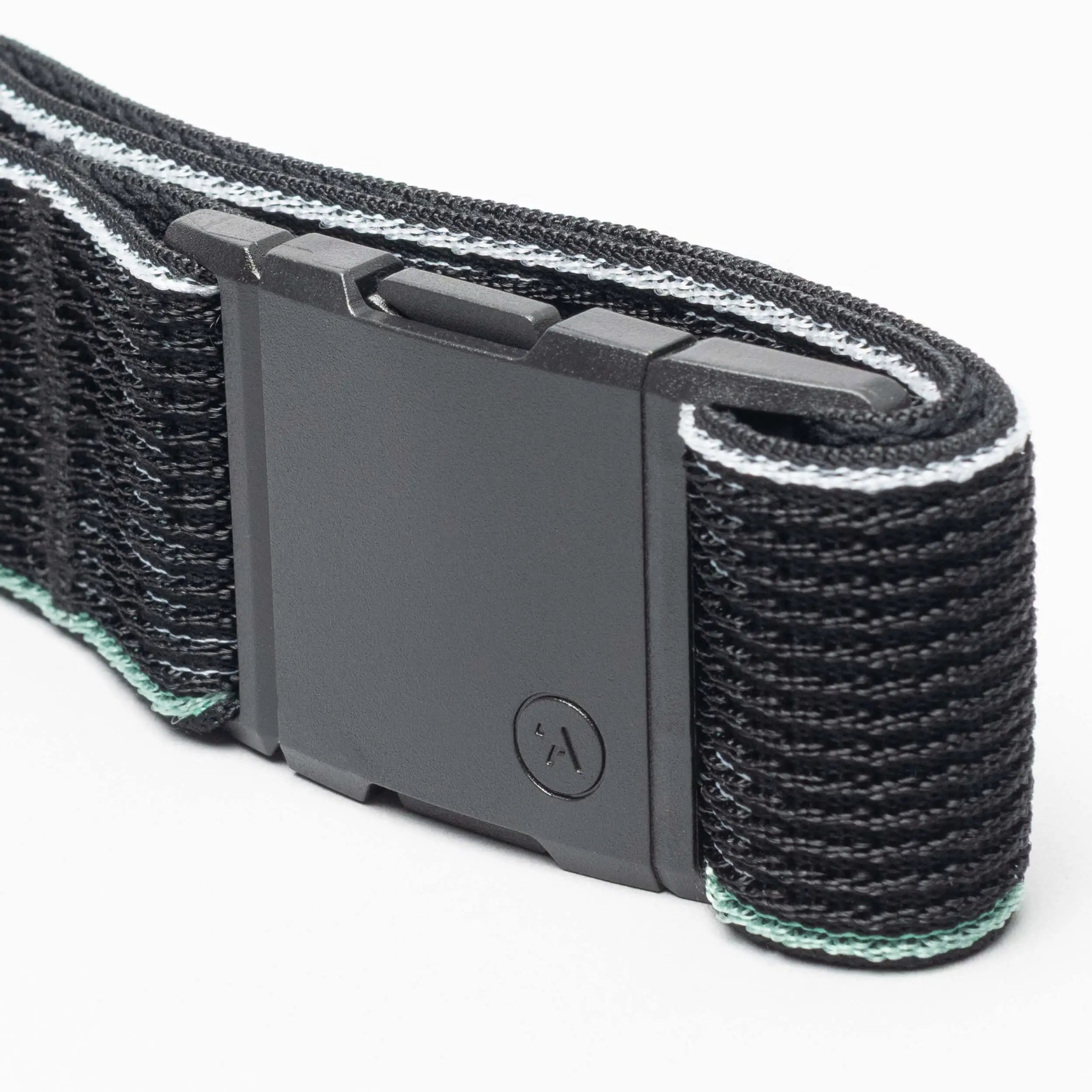 Close-up of the Arcade Belts Cubed, a black belt with a rectangular matte black buckle, textured pattern, thin light blue and white edges, and a small circular A logo.