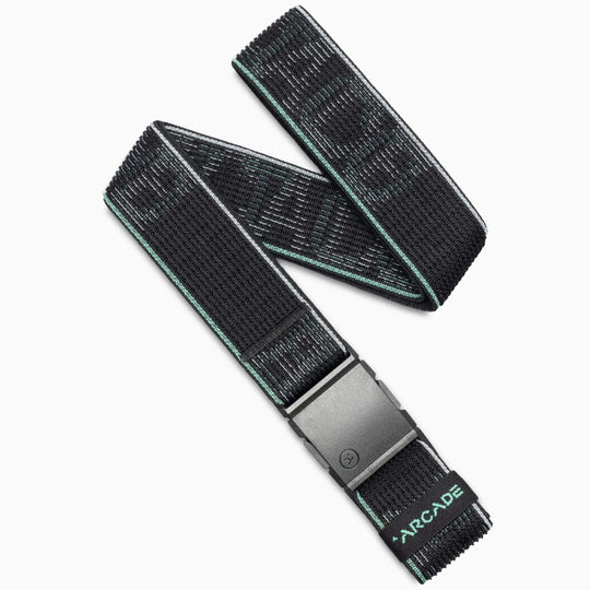 The Arcade Belts Cubed belt in Glacial Mint features a subtle geometric pattern, a black rectangular buckle, and the brand name stitched in light blue. The belt is shown coiled in a loose loop on a white background.