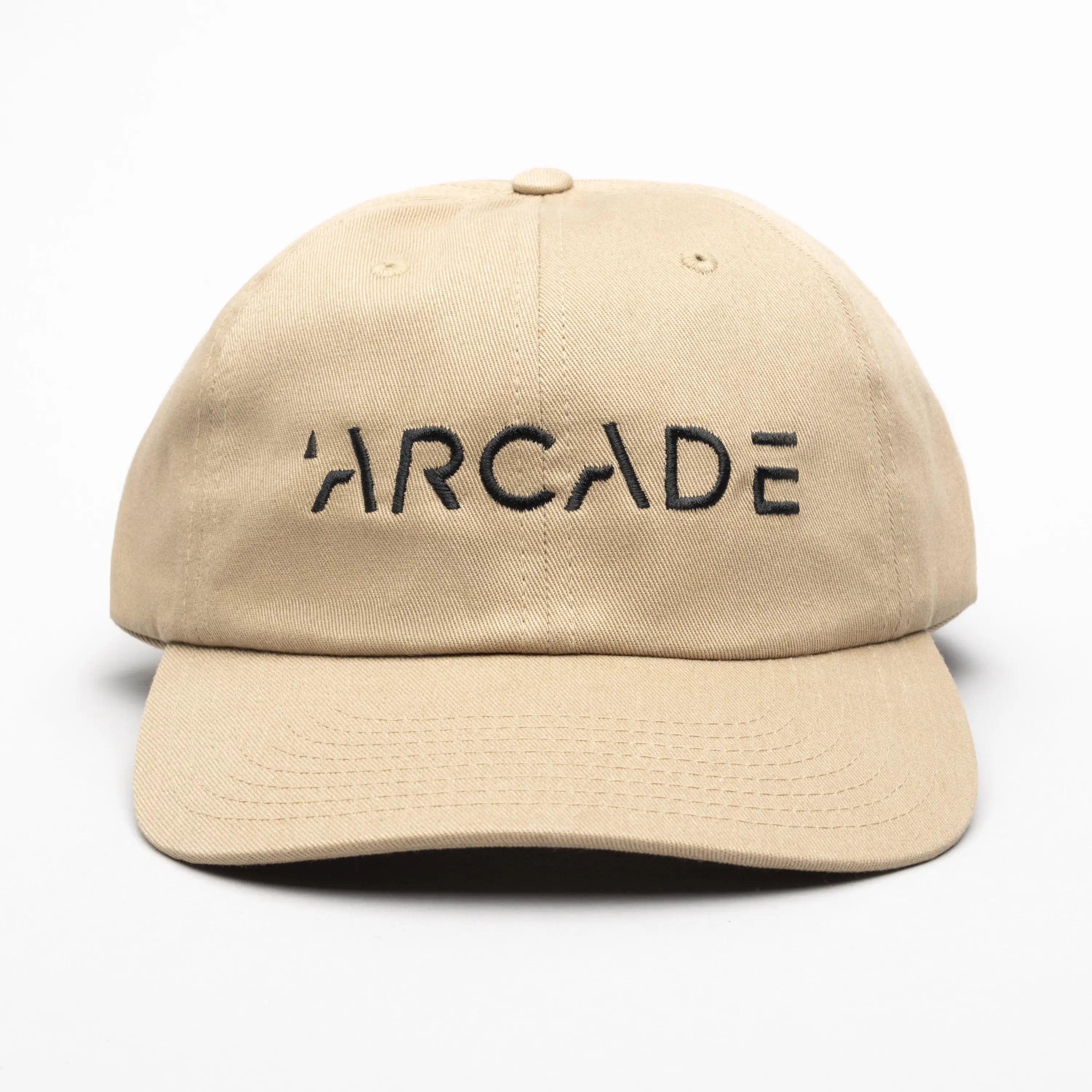 The Arcade Dad Hat by Arcade Belts features bold black ARCADE embroidery on beige and pairs perfectly with a low profile stretch web belt featuring a sleek plastic buckle.