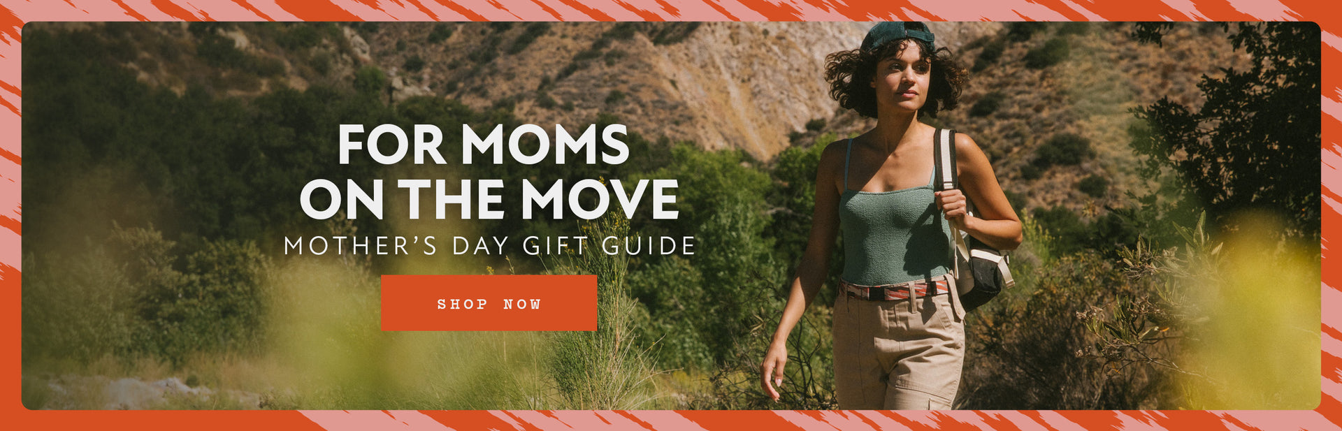 Woman hiking on a trail with a backpack, wearing a green tank top, beige shorts, and an Elastic Stretch Belt. The text reads For Moms on the Move - Mothers Day Gift Guide with a Shop Now button.