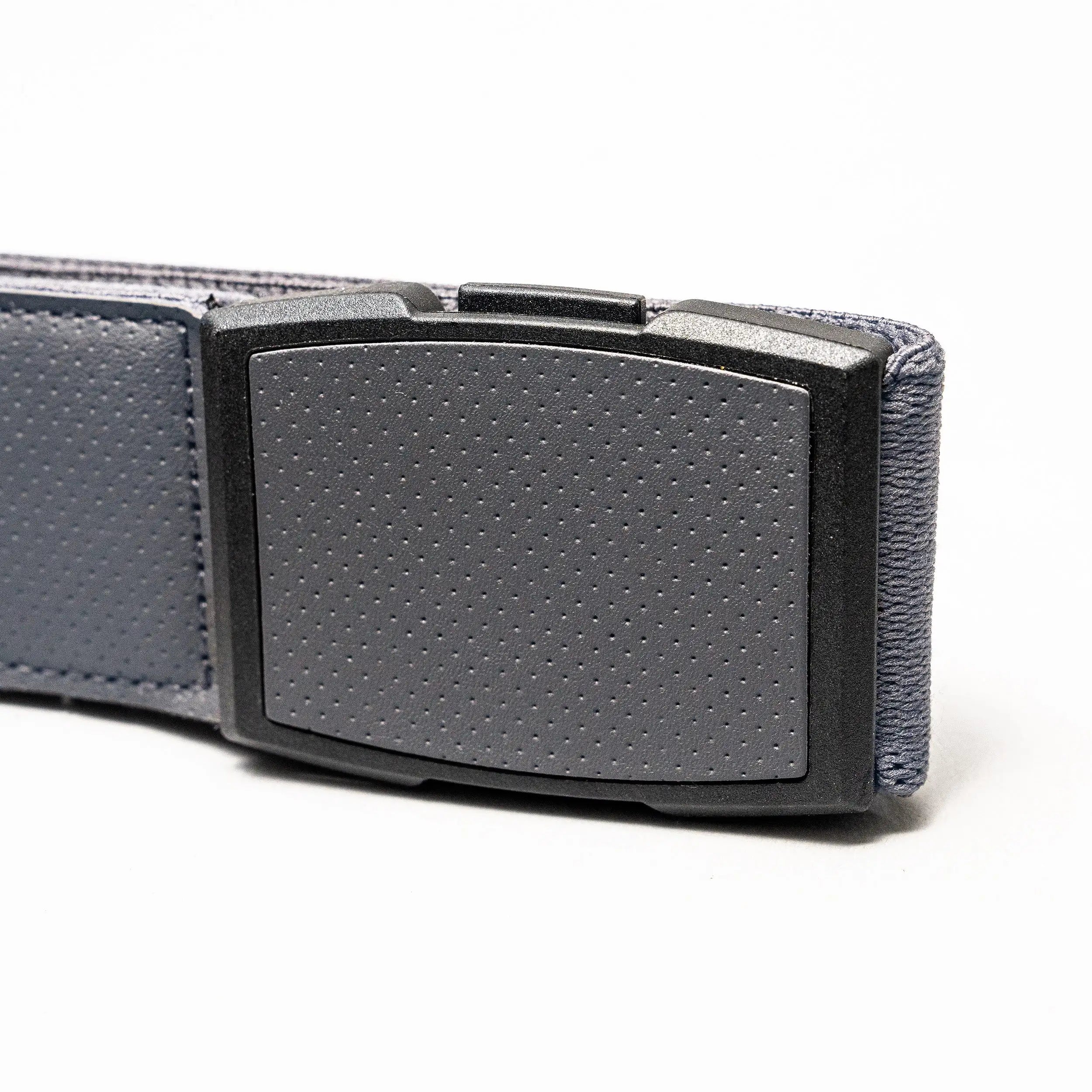 A close-up of the gray Elevation belt by Arcade Belts, featuring a textured, low-profile plastic buckle against a plain white background.