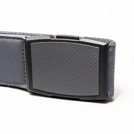 A close-up of the gray Elevation belt by Arcade Belts, featuring a textured, low-profile plastic buckle against a plain white background.