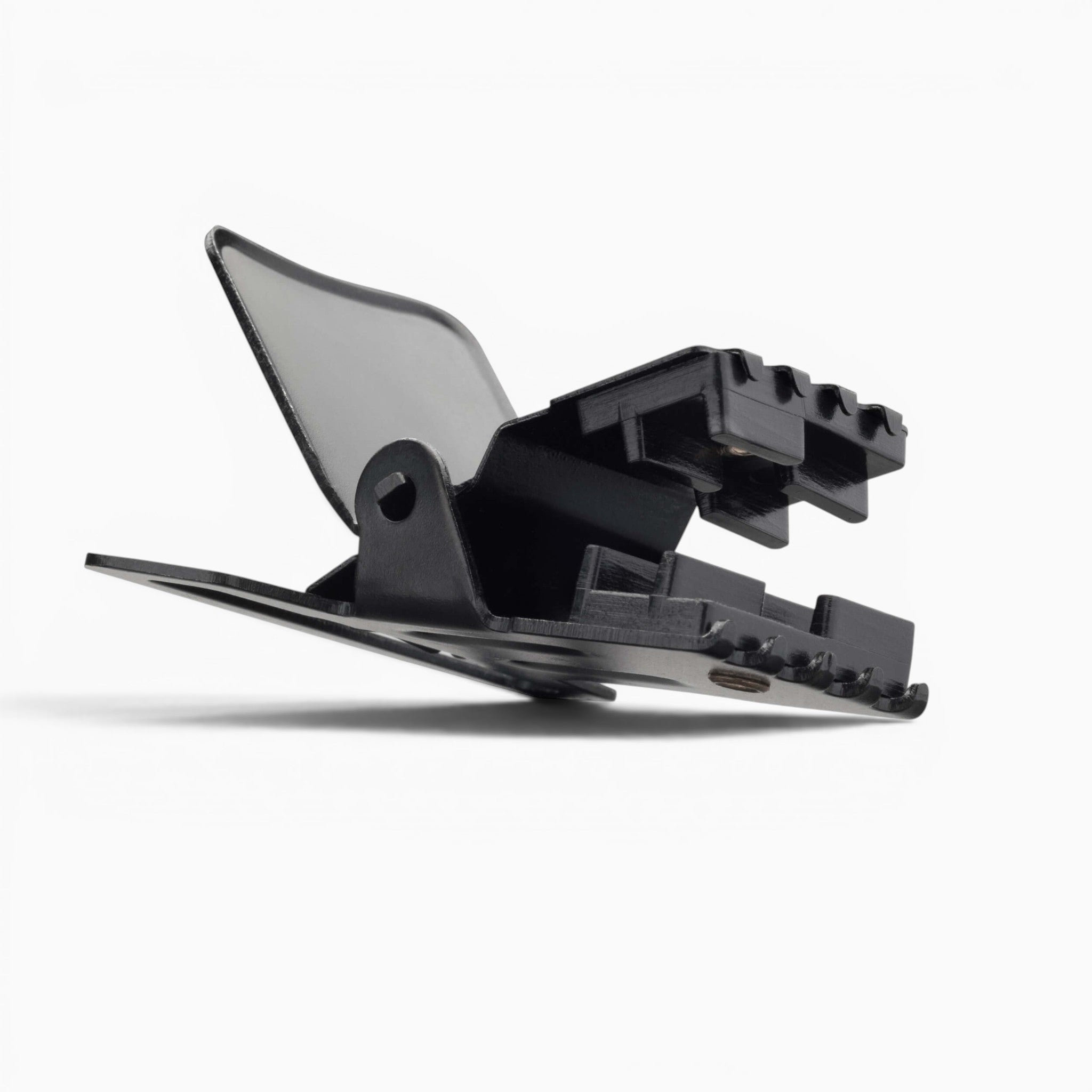 A close-up of the Jessup black plastic clip by Arcade Belts, featuring a hinged lever and ridged gripping edges for secure attachment, commonly used as durable hardware for suspenders, photographed on a white background.
