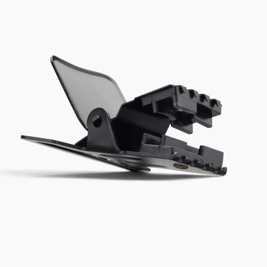 A close-up of the Jessup black plastic clip by Arcade Belts, featuring a hinged lever and ridged gripping edges for secure attachment, commonly used as durable hardware for suspenders, photographed on a white background.