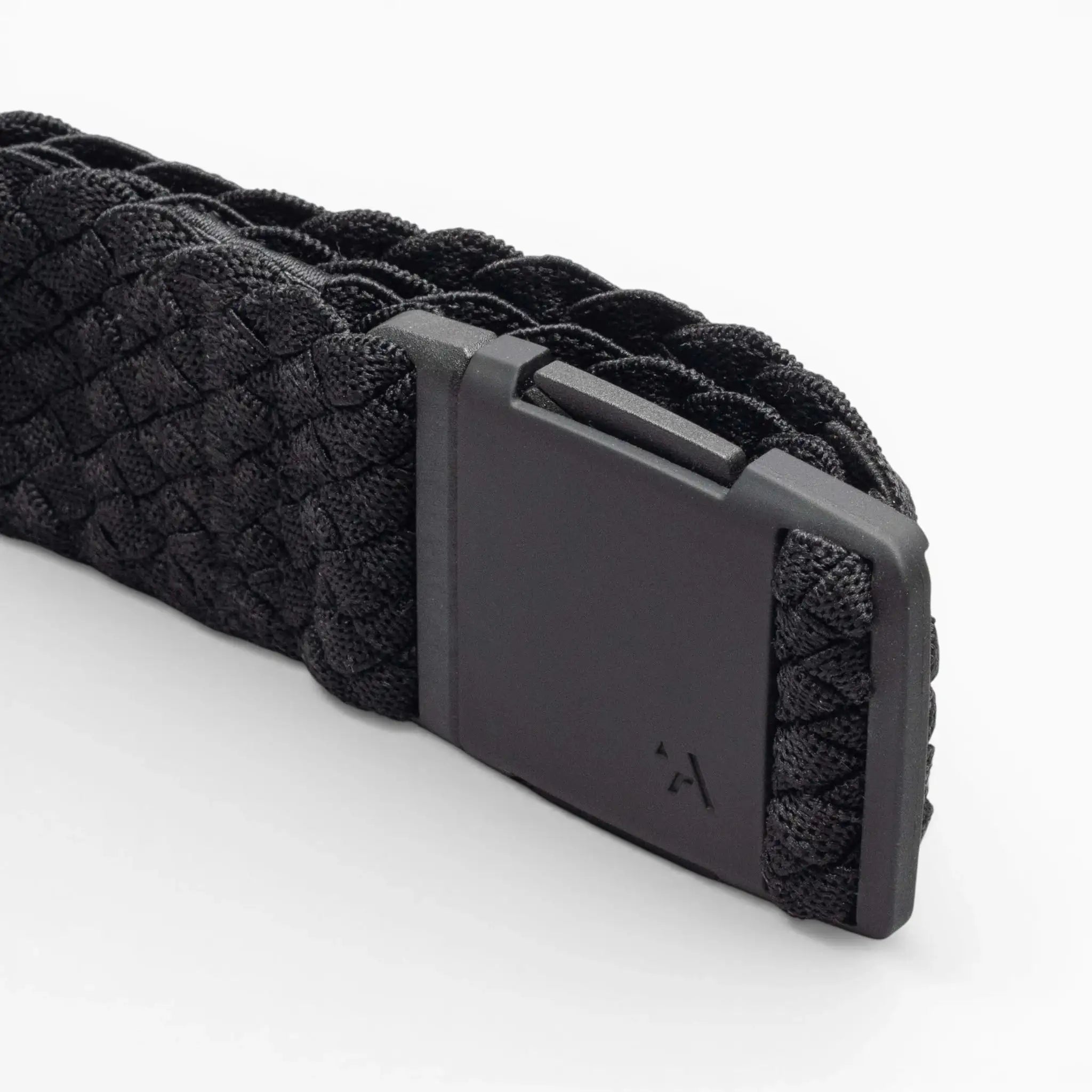 A close-up of the Arcade Belts Futureweave, a black woven webbing belt with a matte black rectangular buckle and subtle arrow logo, shown on a plain white background.