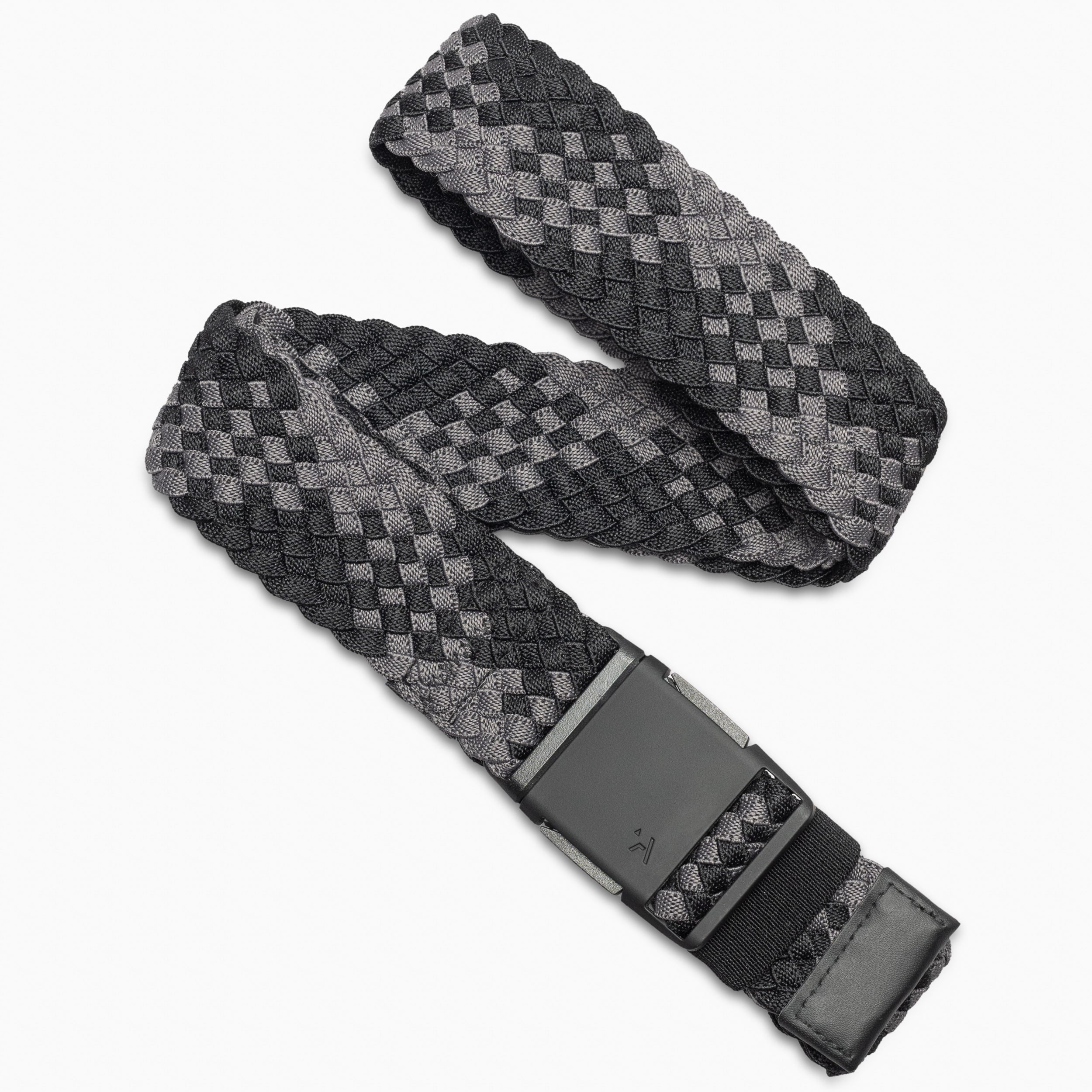 The Arcade Belts Futureweave Kit is a woven fabric belt with a black and gray checkered pattern, crafted using Futureweave technology for comfort. It features a rectangular black buckle and a matching checkered loop near the end.