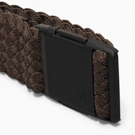 A close-up of the Arcade Belts Futureweave, a brown braided fabric belt featuring a matte black rectangular buckle and crafted from lightweight woven webbing for a comfortable fit, photographed against a white background.