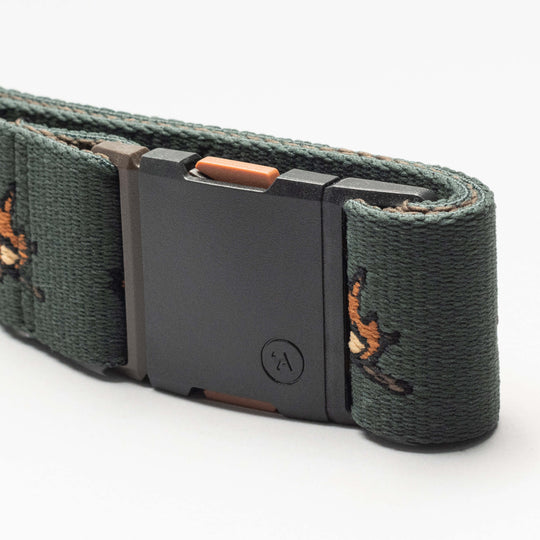 A close-up of the dark green Get Outside Low Profile Belt by Arcade Belts, featuring embroidered orange and brown birds and a rectangular plastic buckle with a small circular logo—ideal for travel.