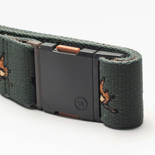 A close-up of the dark green Get Outside Low Profile Belt by Arcade Belts, featuring embroidered orange and brown birds and a rectangular plastic buckle with a small circular logo—ideal for travel.