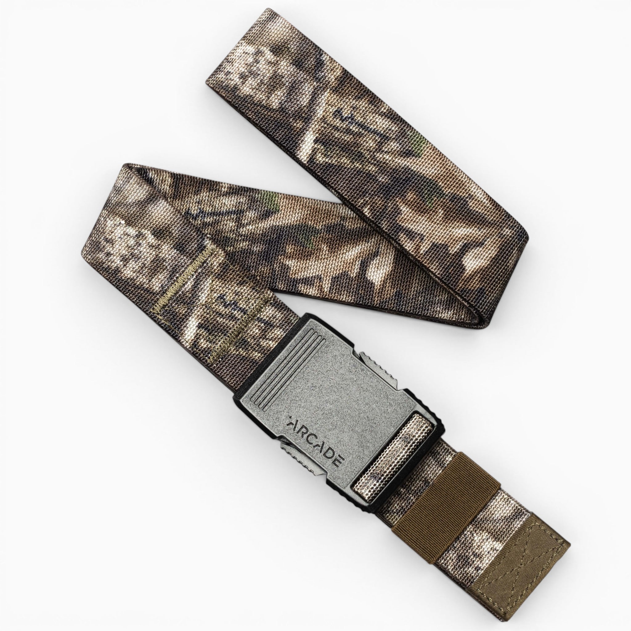 Introducing the Realtree Kit by Arcade Belts—a performance essential featuring a camouflage-patterned fabric and a silver rectangular buckle embossed with "ARCADE." Partially looped to showcase its Realtree-inspired design and branded buckle, this belt is the perfect addition to your camo kit.